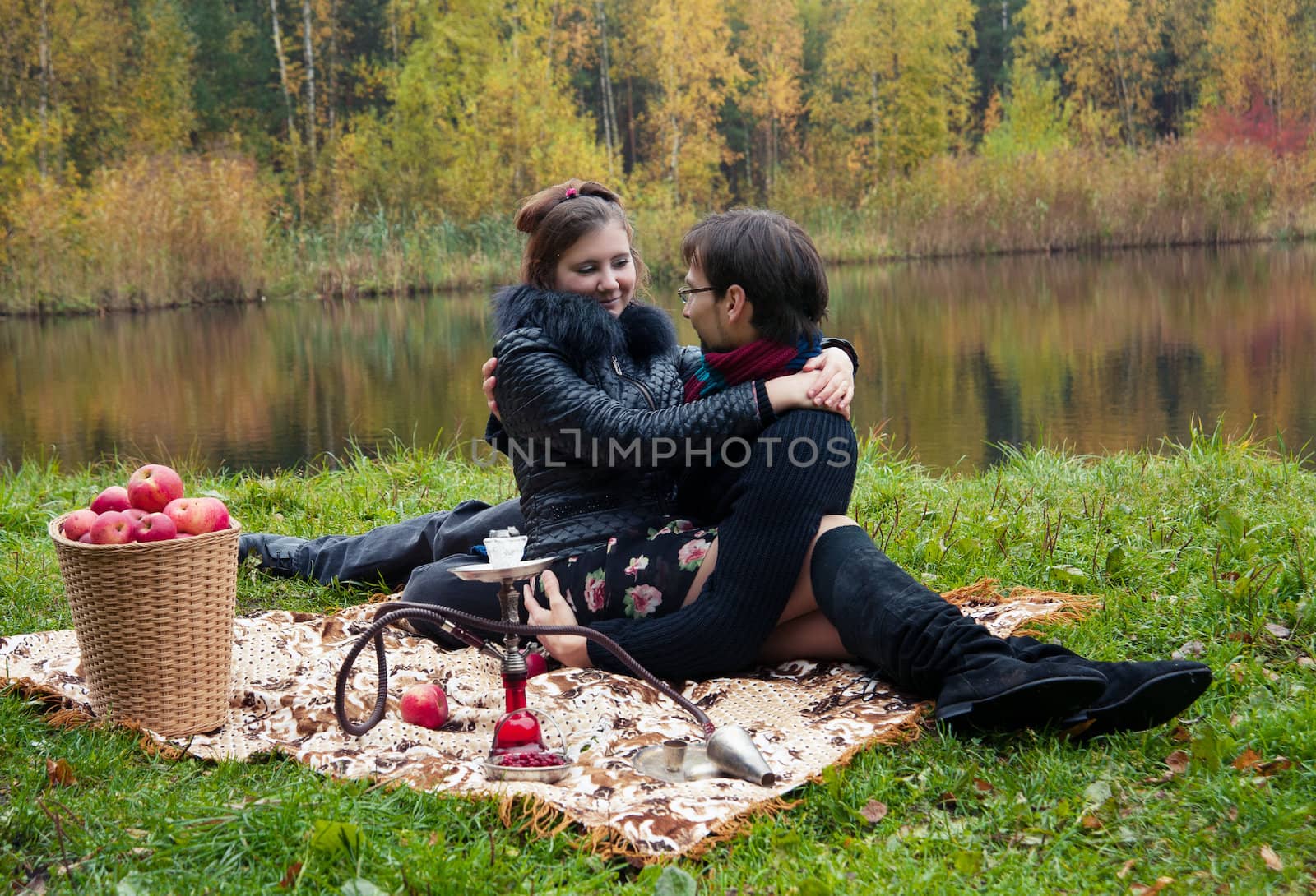 relationship between man and a woman at a picnic with a hookah