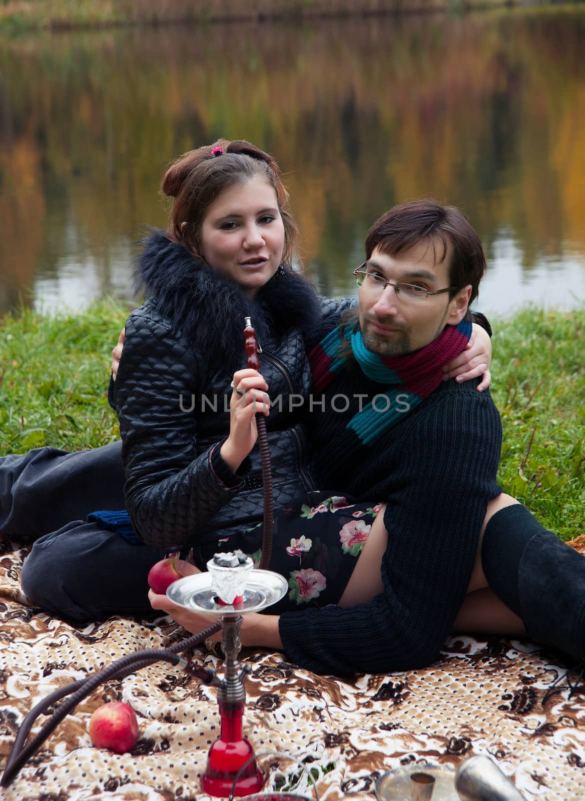 relationship between man and a woman at a picnic with a hookah