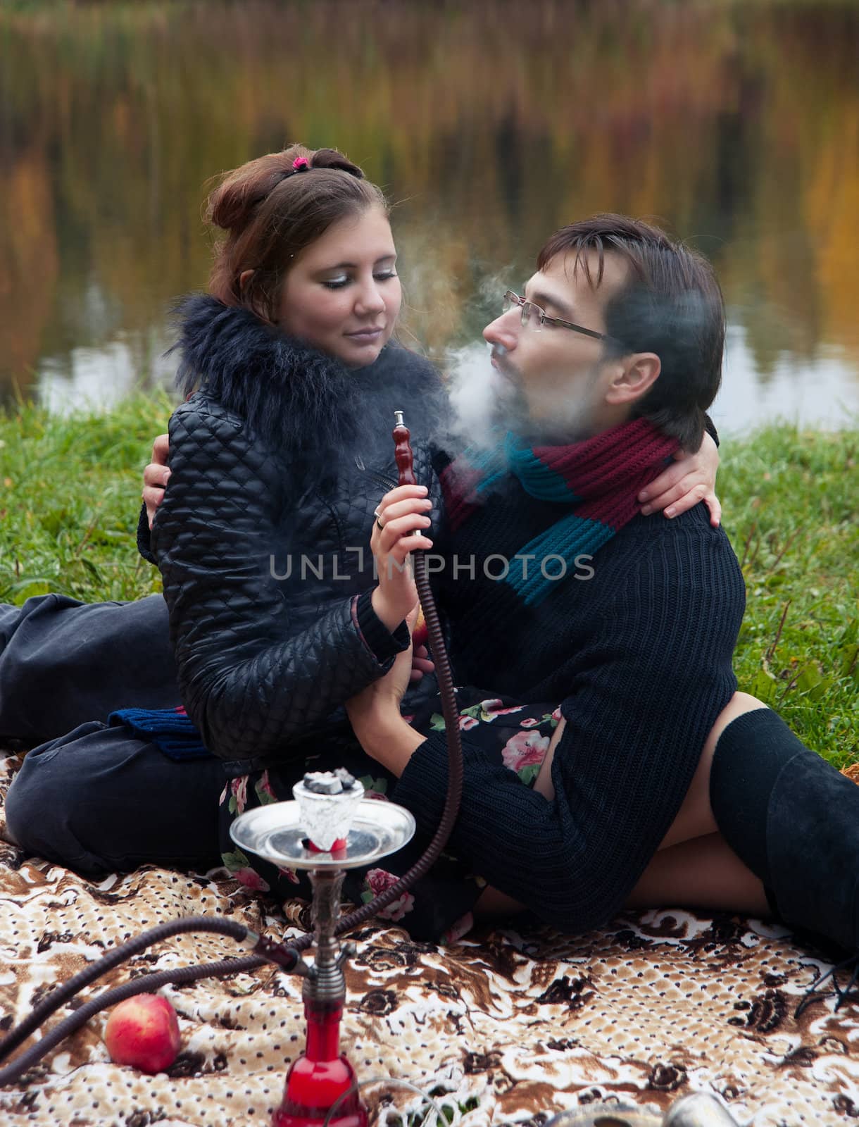 relationship between man and a woman at a picnic with a hookah