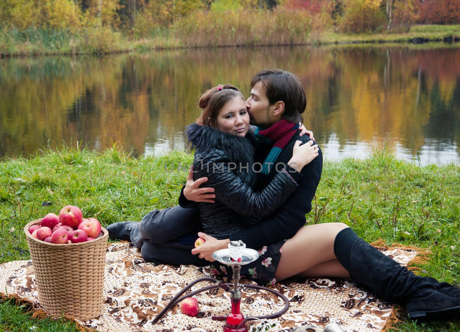 relationship between man and a woman at a picnic with a hookah