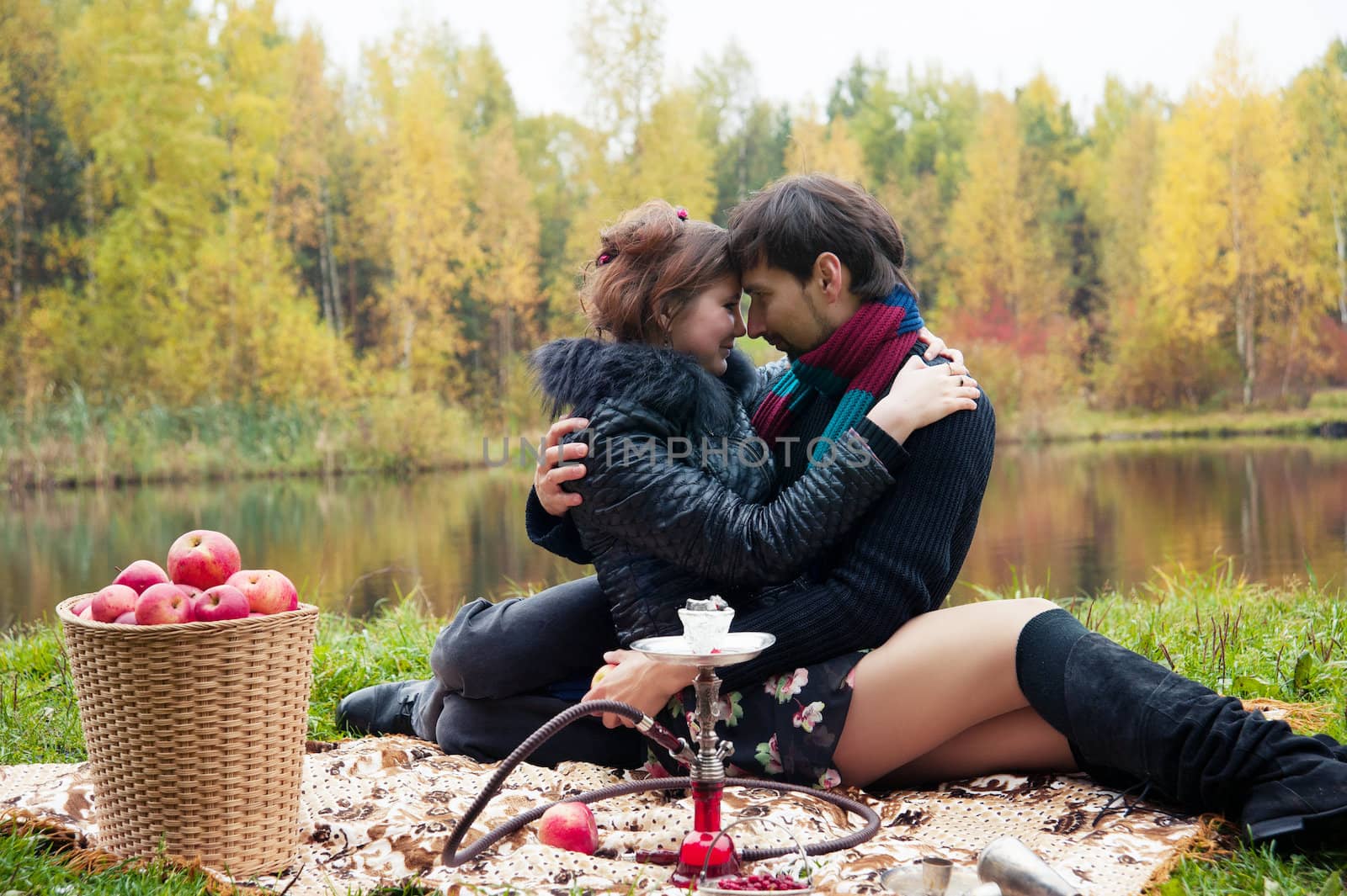 relationship between man and a woman at a picnic with a hookah