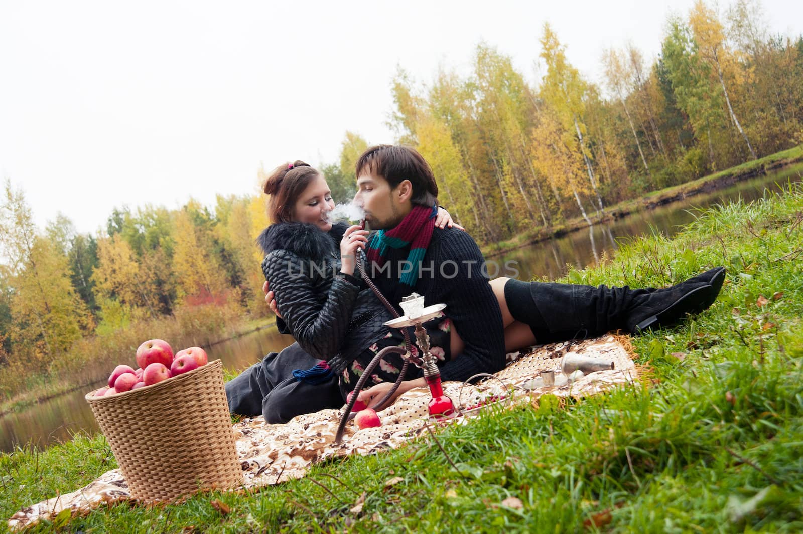 relationship between man and a woman at a picnic with a hookah