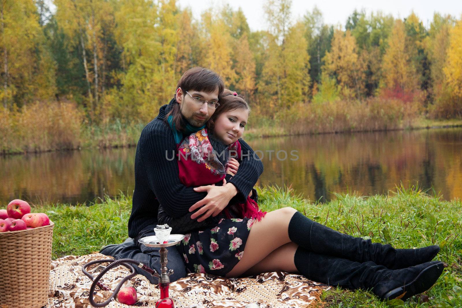 relationship between man and a woman at a picnic with a hookah