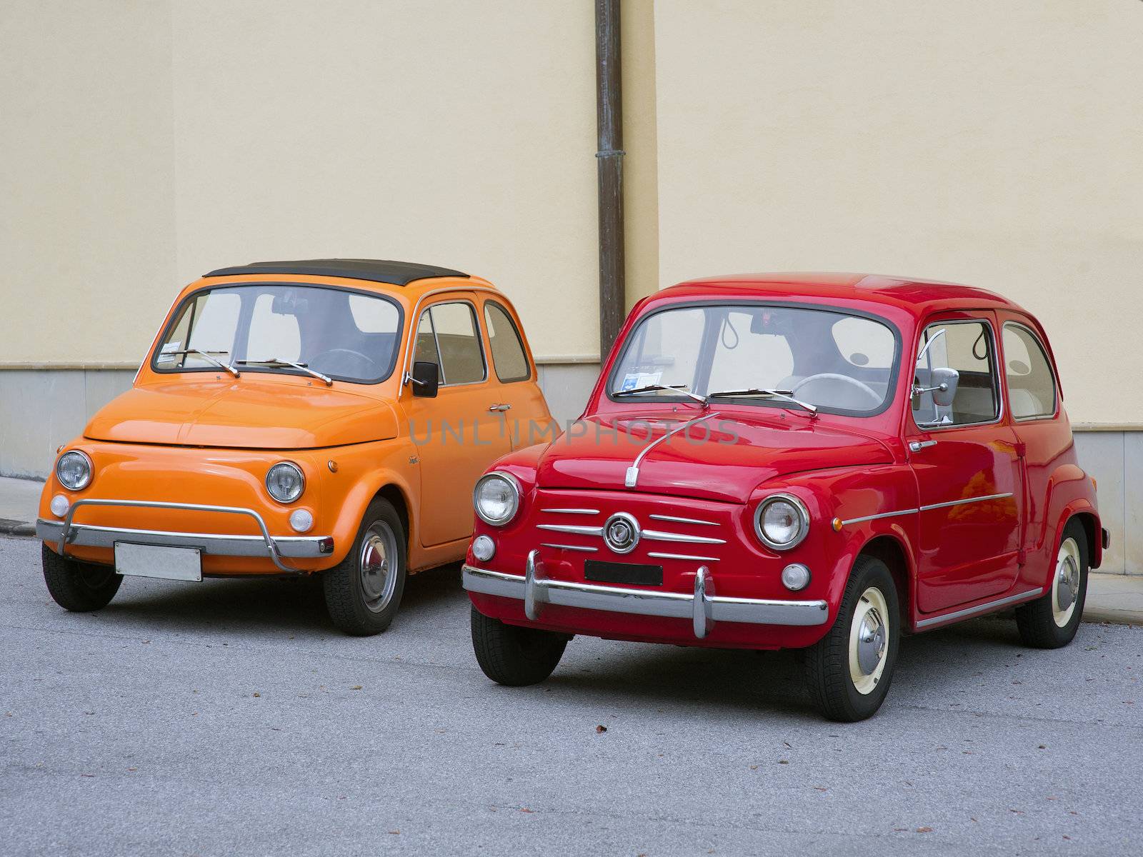 two vintage cars excellently restored