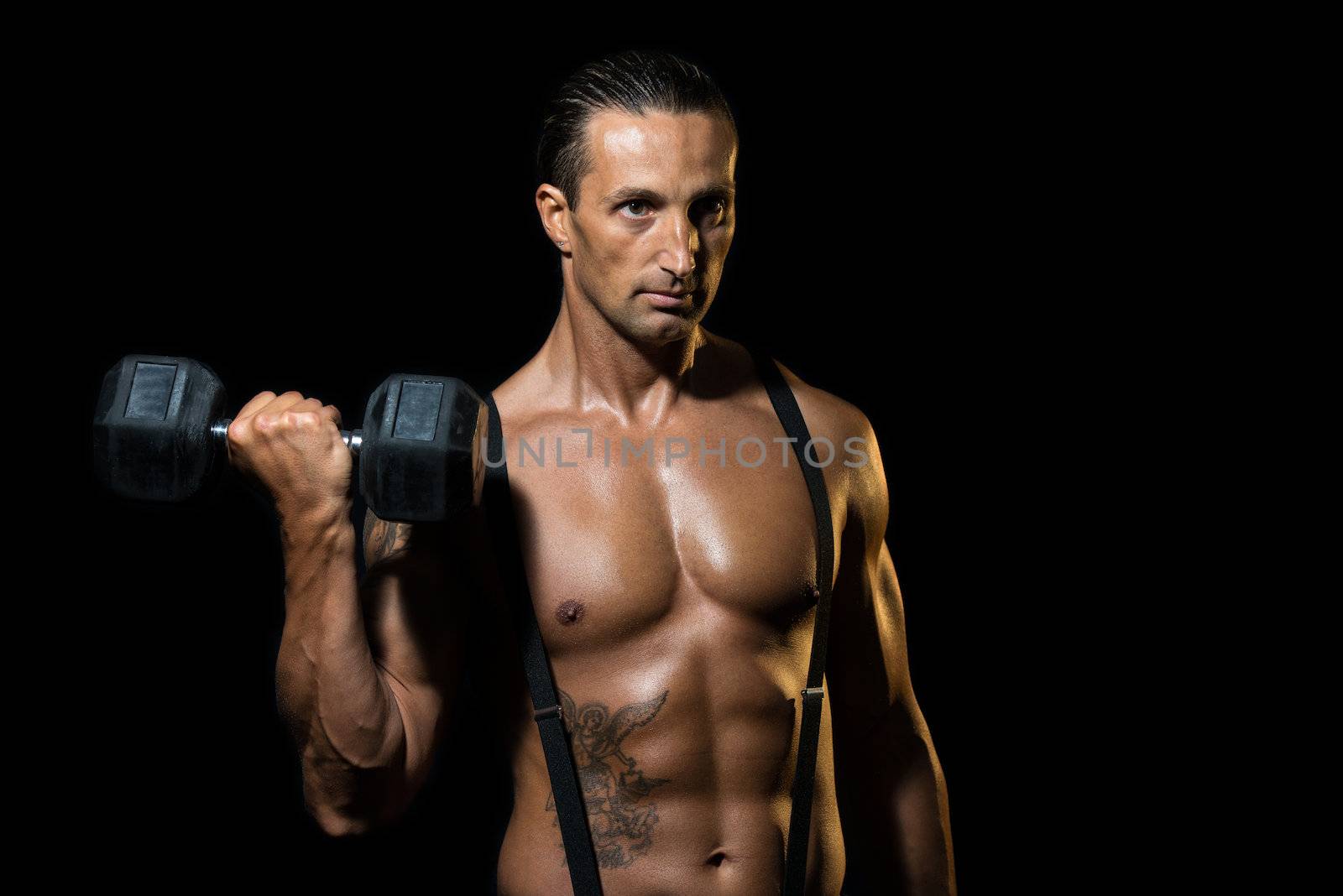 Powerful muscular man lifting weights by JalePhoto