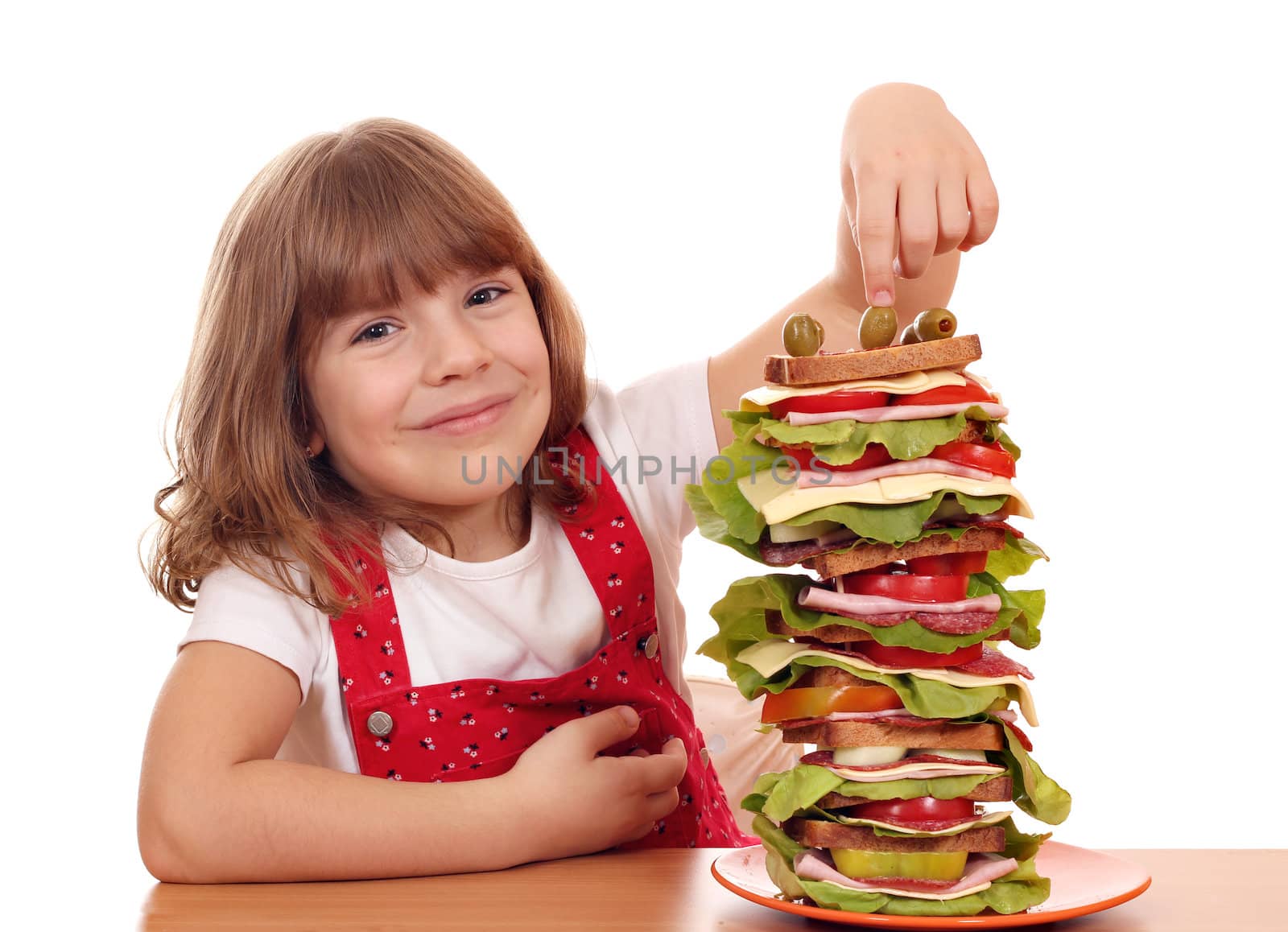 happy little girl with tall sandwich