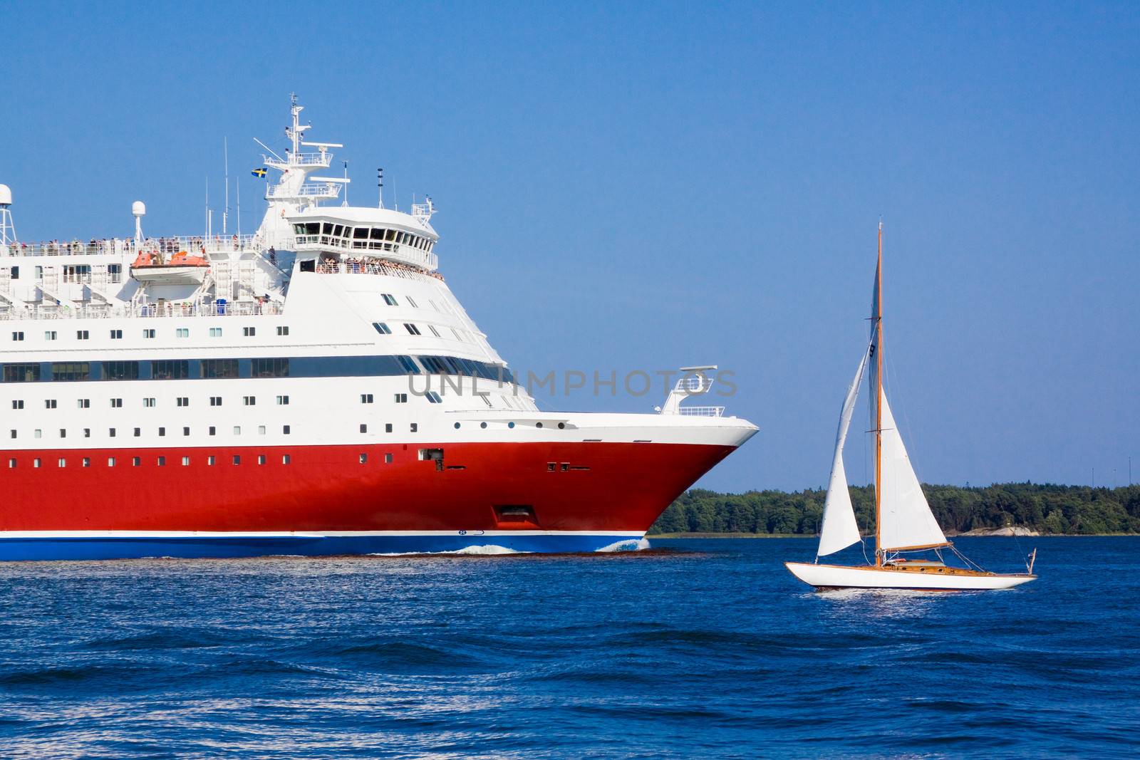 
the passenger cruise liner floats by sea by the island

