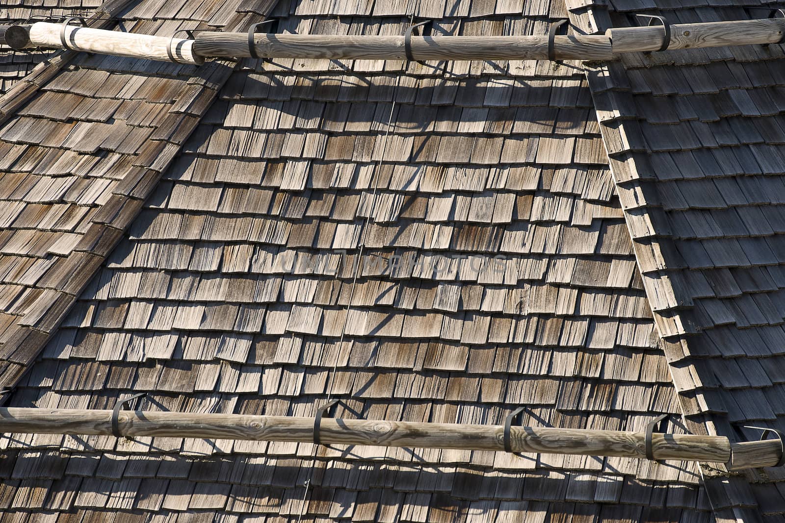 Detail of old wooden roof with snow guards trunk - Friuli Italy