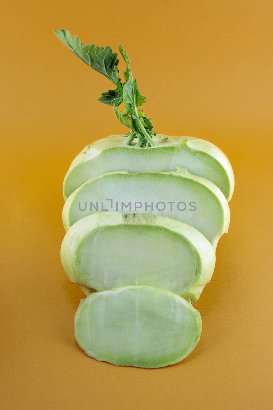 Cabbage kohlrabi on orange background