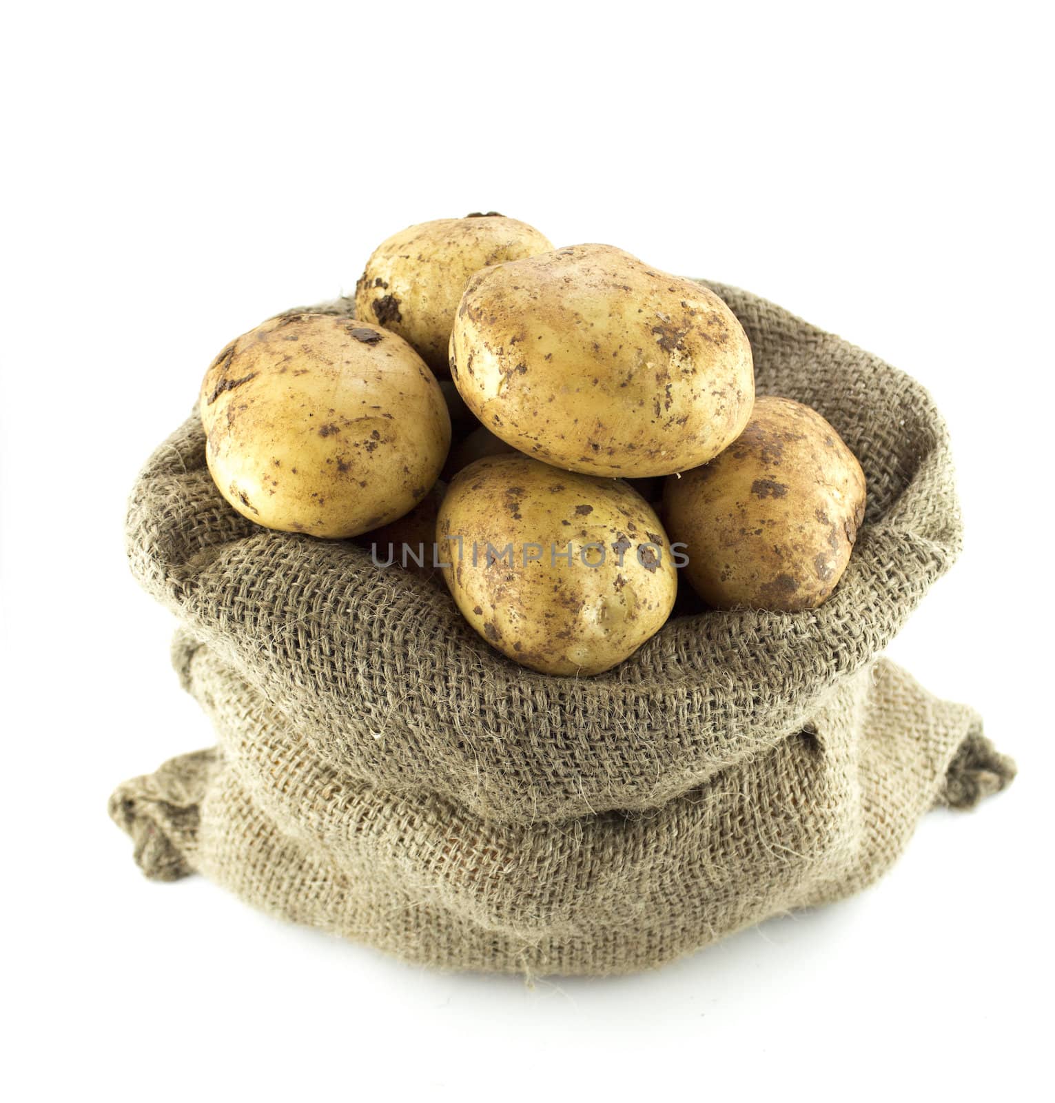 potatoes in burlap sack isolated on white background