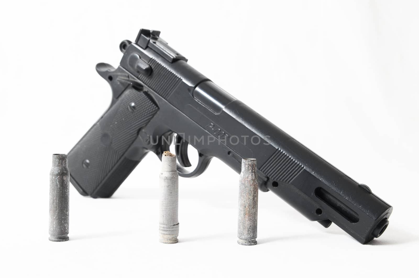 Pistol Gun and Bullets on a White Background