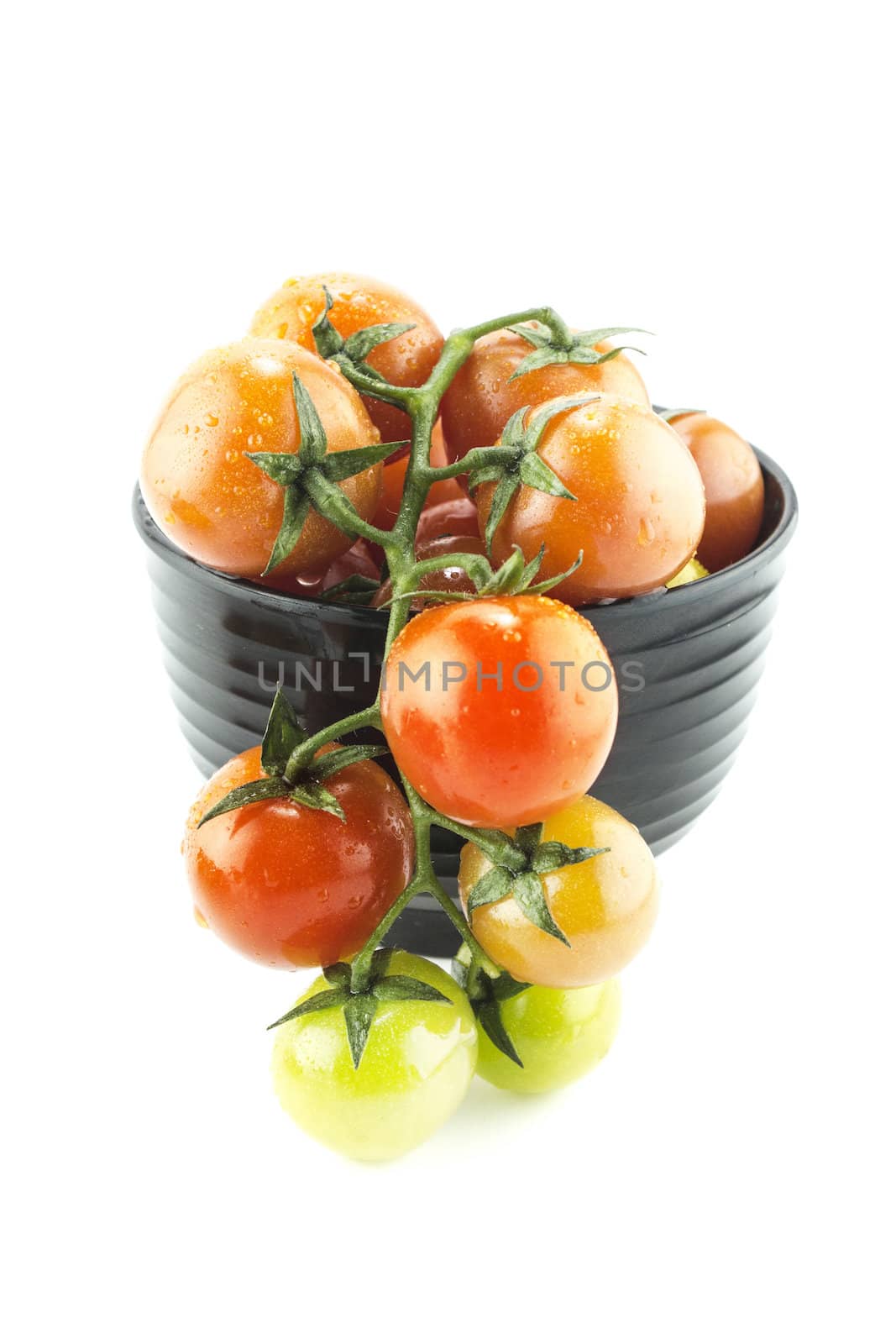 fresh cherry tomatoes with water drops on white background