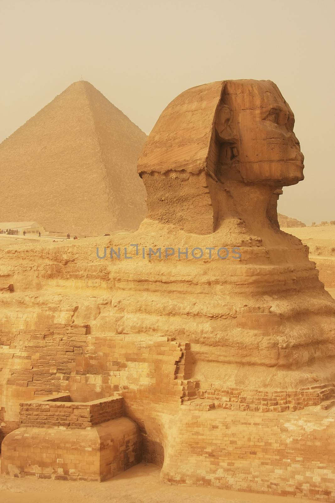 The Sphinx and Great Pyramid of Khufu in a sand storm, Cairo by donya_nedomam