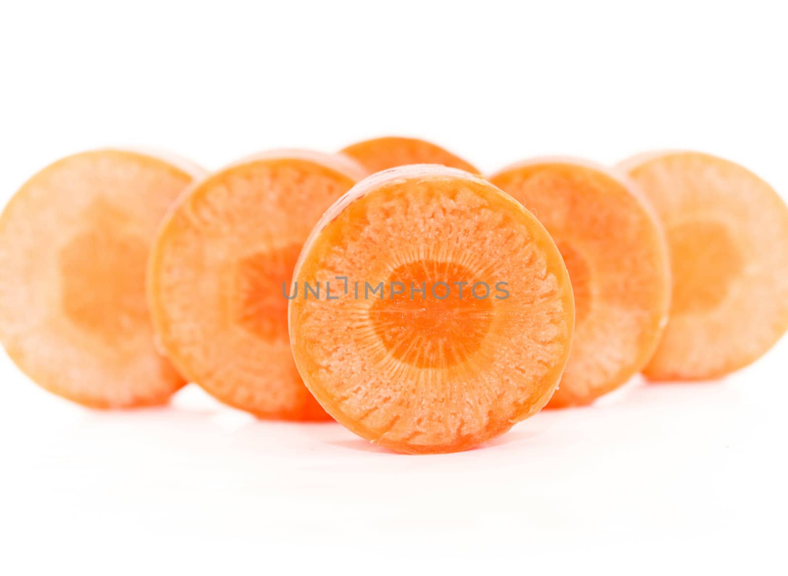 Sweet and fresh carrots with slices isolated on white background