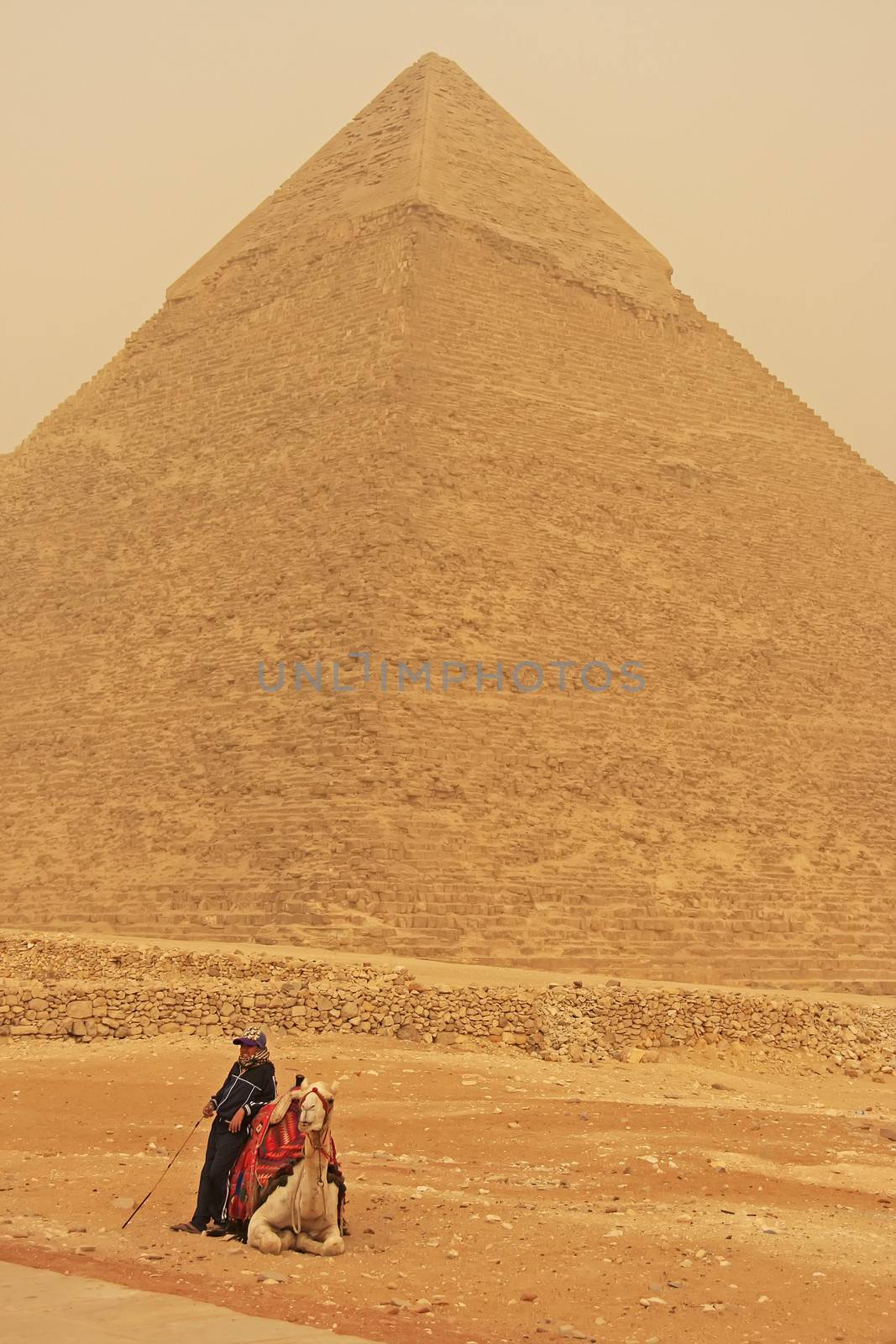 Bedouin resting near Pyramid of Khafre during sand storm, Cairo