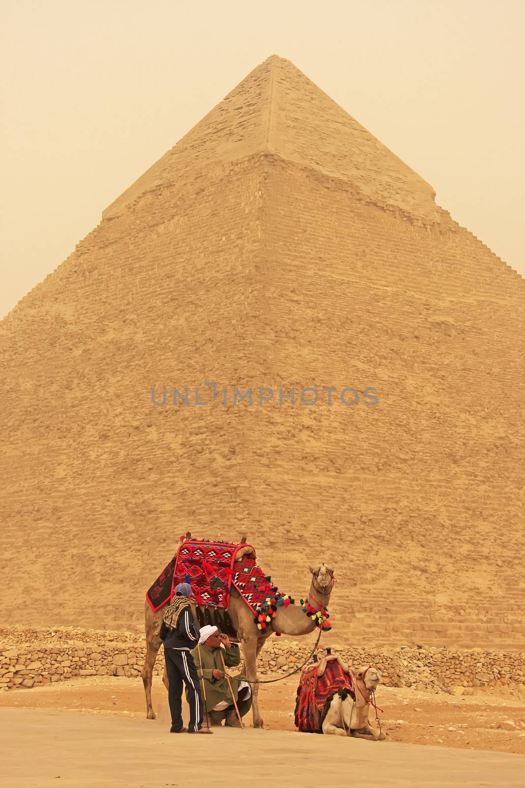 Bedouins resting near Pyramid of Khafre during sand storm, Cairo by donya_nedomam