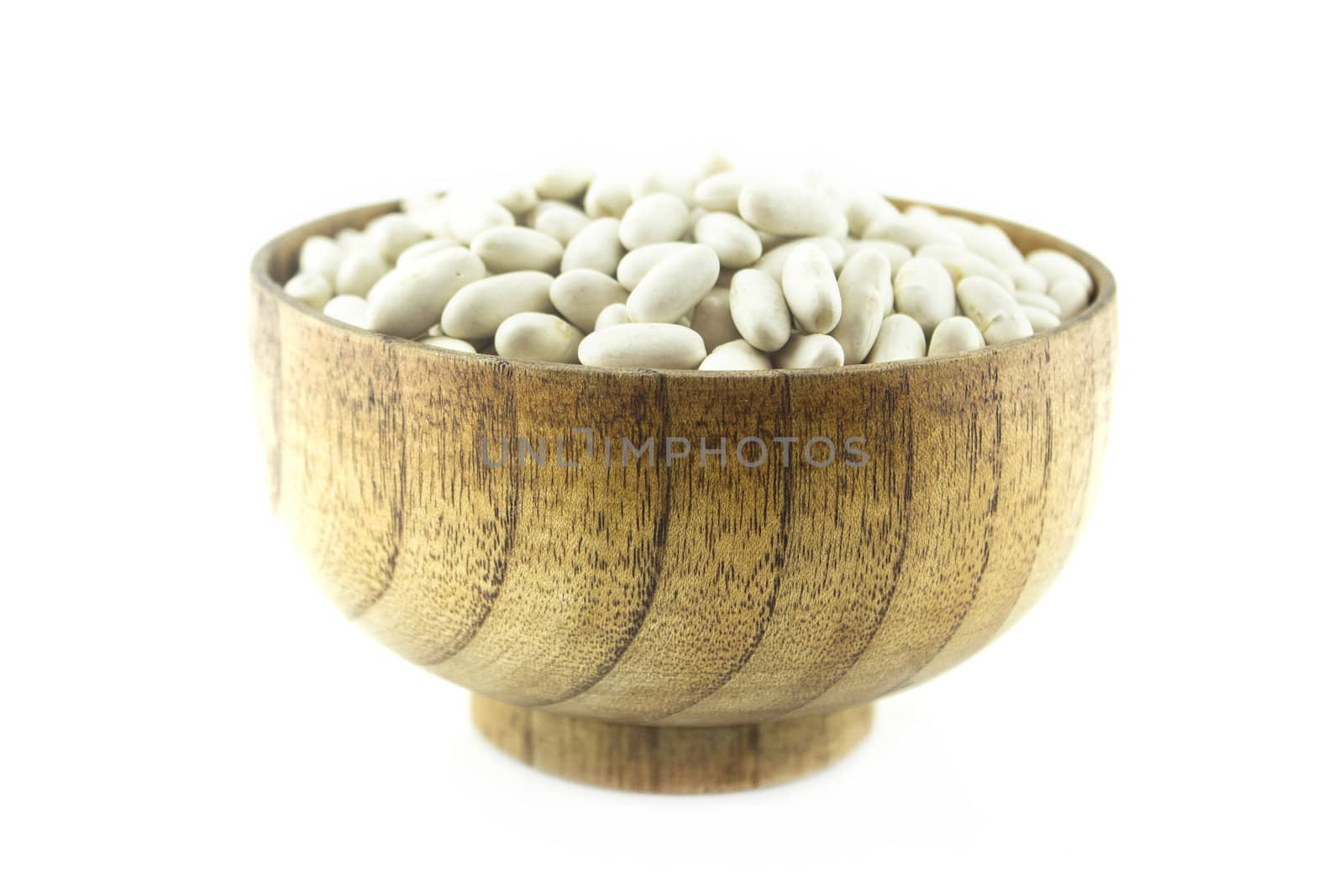 Pile Lima Bean in wooden plate isolated on white background