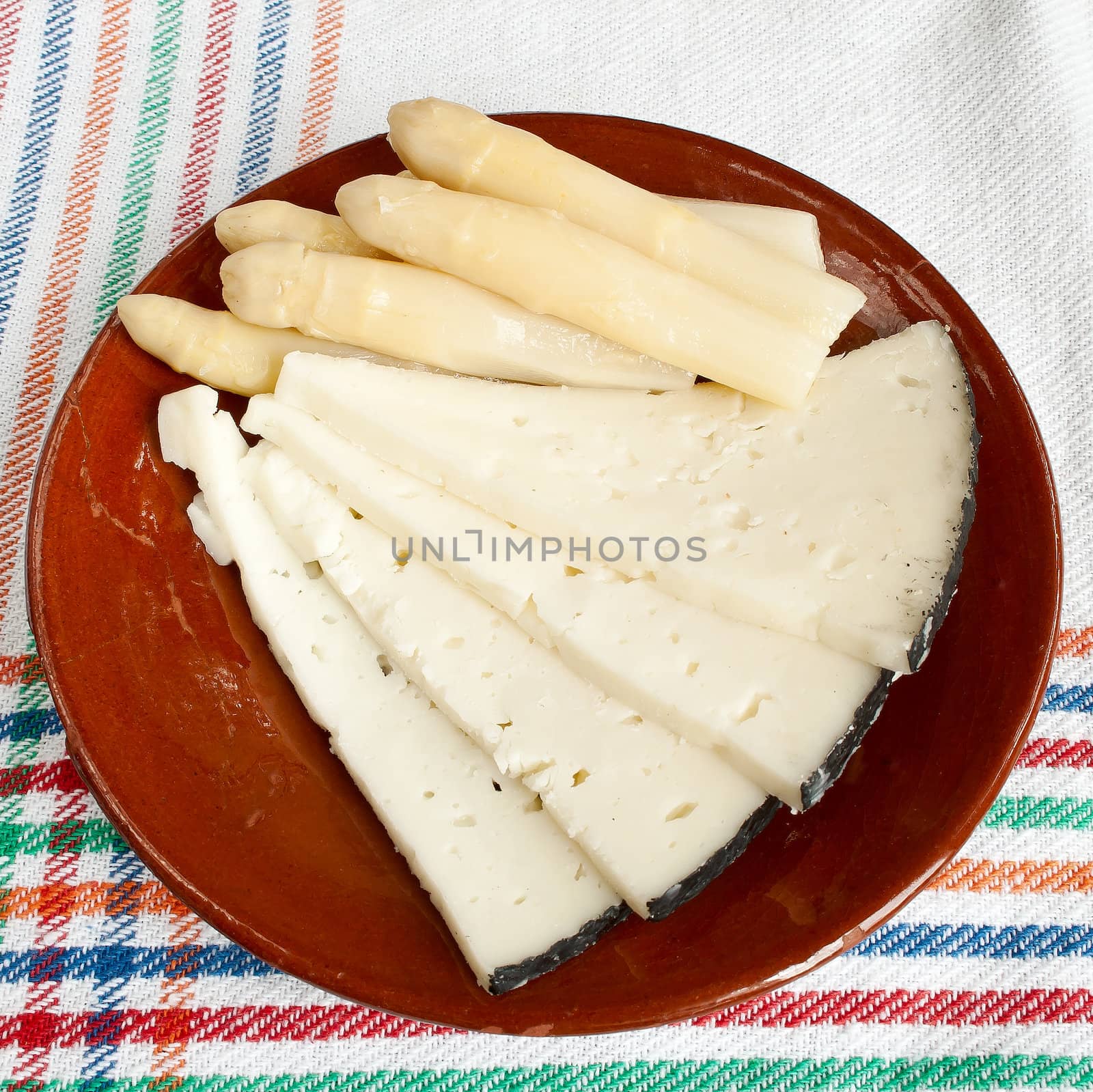 White asparagus and cheese on ceramic plate