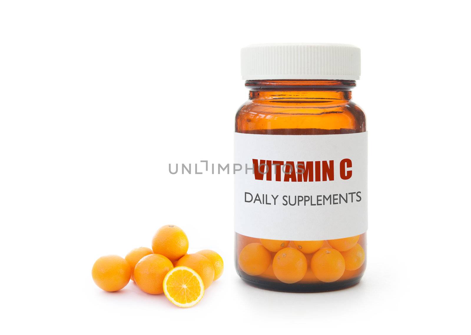 Miniature oranges inside a vitamin pill container 