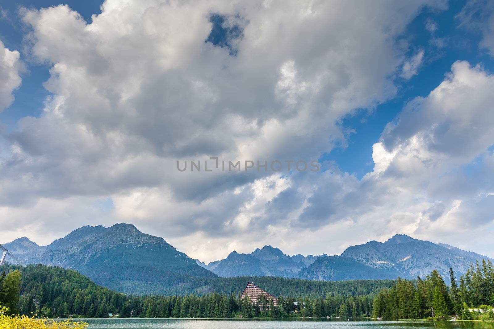 Clouds over mountain lake in National Park High Tatra. Strbske pleso, Slovakia, Europe