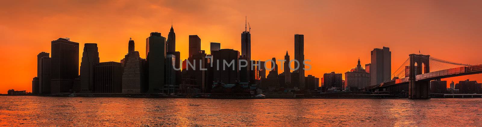 Silhouettes of Manhattan. Early morning New York City skyline panorama with Brooklyn Bridge