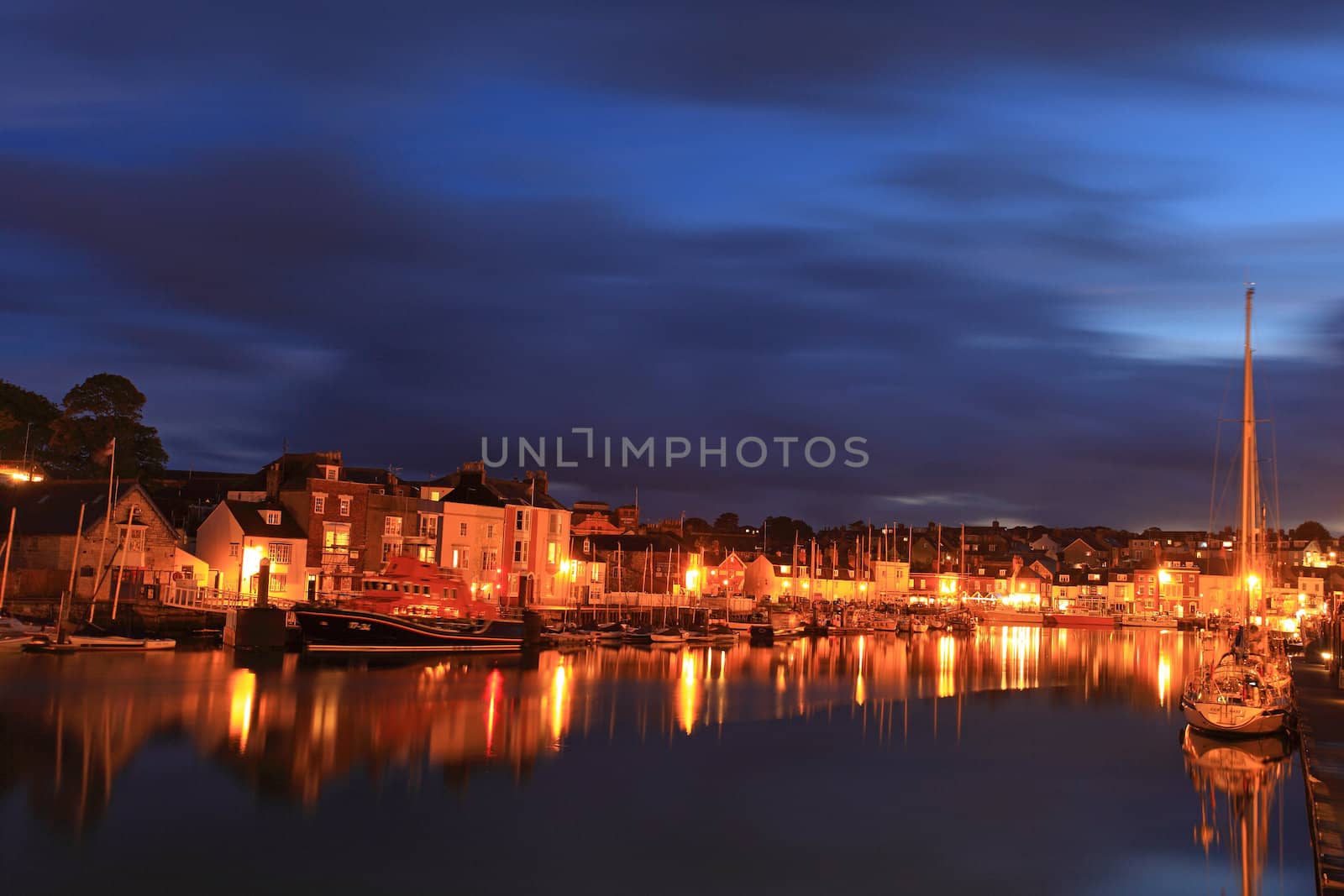 Town Lights Light up Weymouth Quay as Night Sets in in Dorset