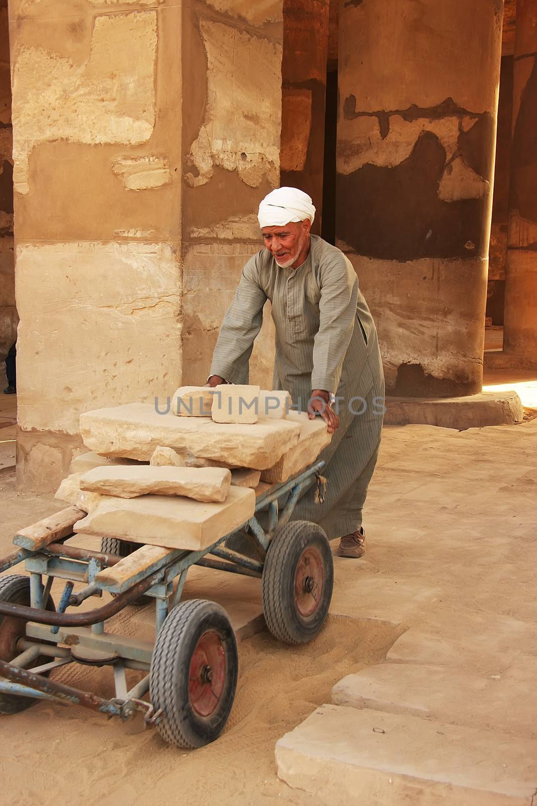 Local man working at Karnak temple complex, Luxor, Egypt