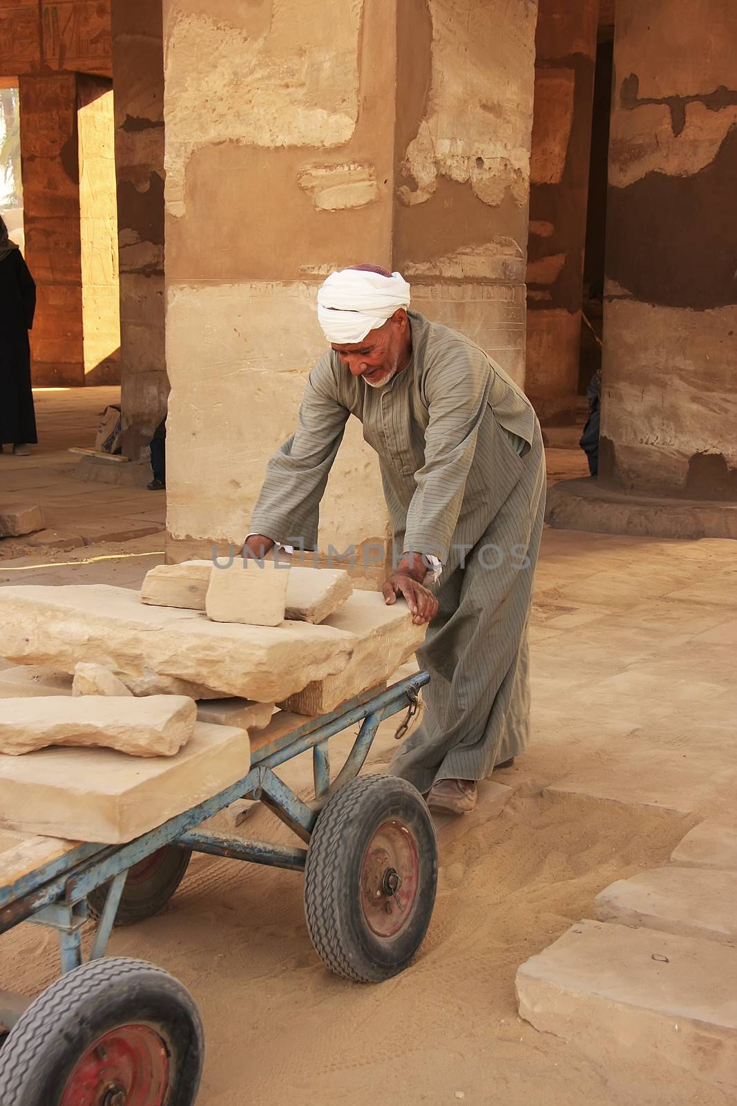 Local man working at Karnak temple complex, Luxor, Egypt