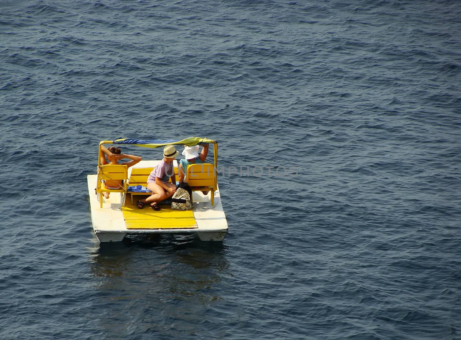 Tourists resting on catamaran, Simeiz, Crimea peninsula, Ukraine