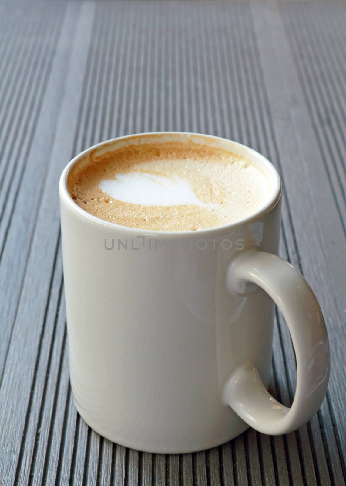 Hot coffee cup on a wooden table