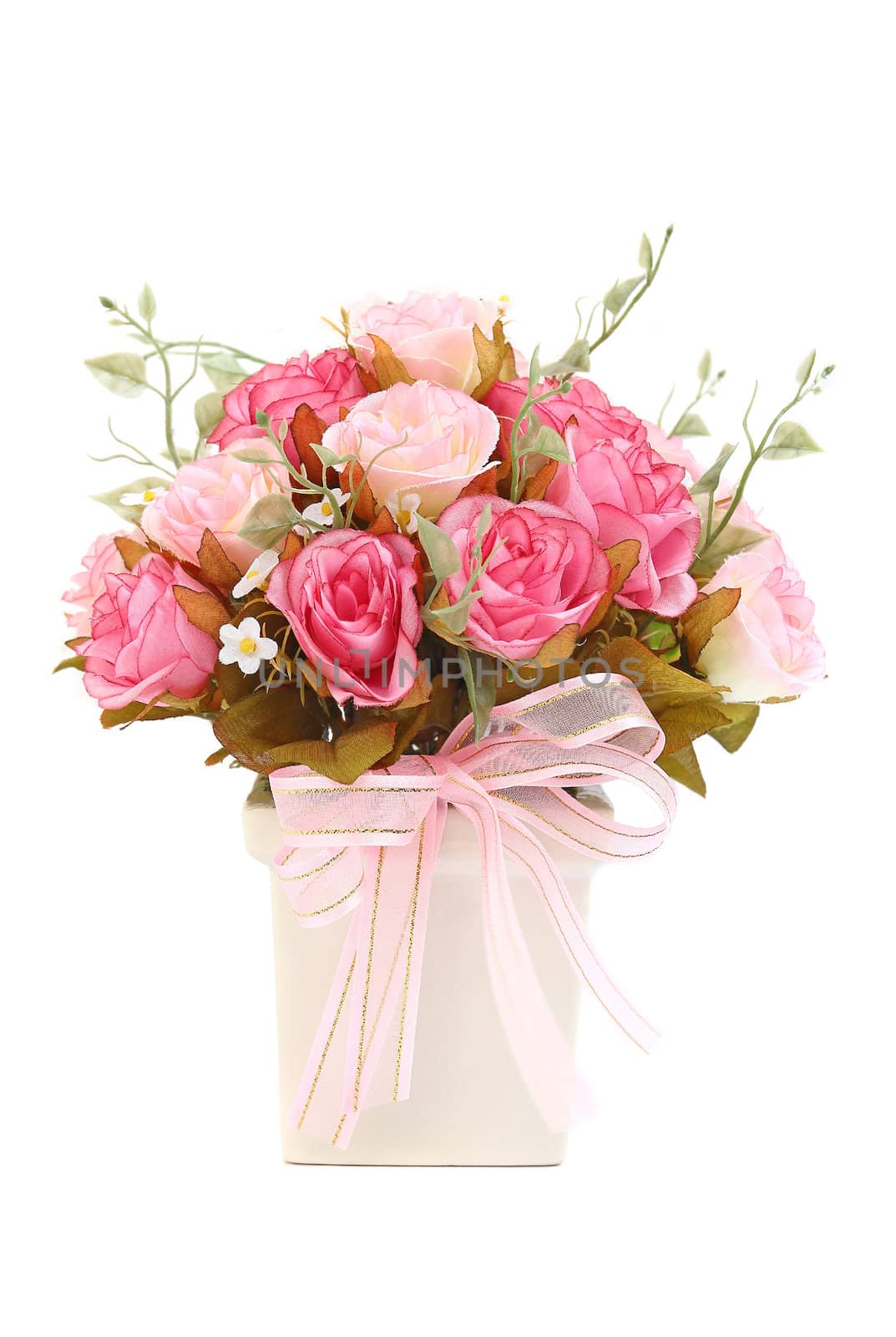 Pink roses in a vase and pink ribbon isolated on white background