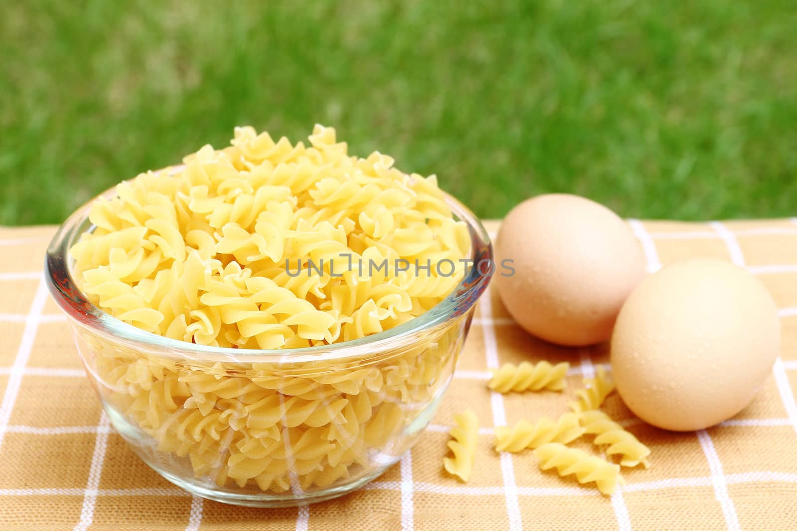 Close up fusilli pasta in a glass bowl