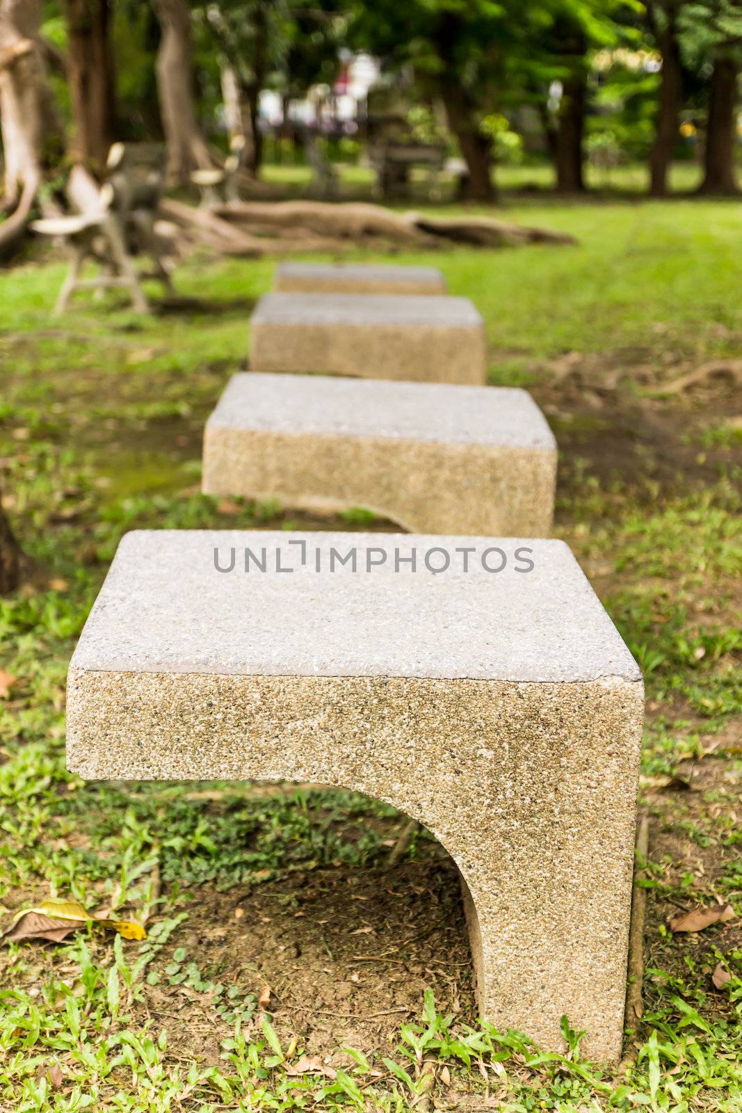 Stone chair  in garden  by photo2life