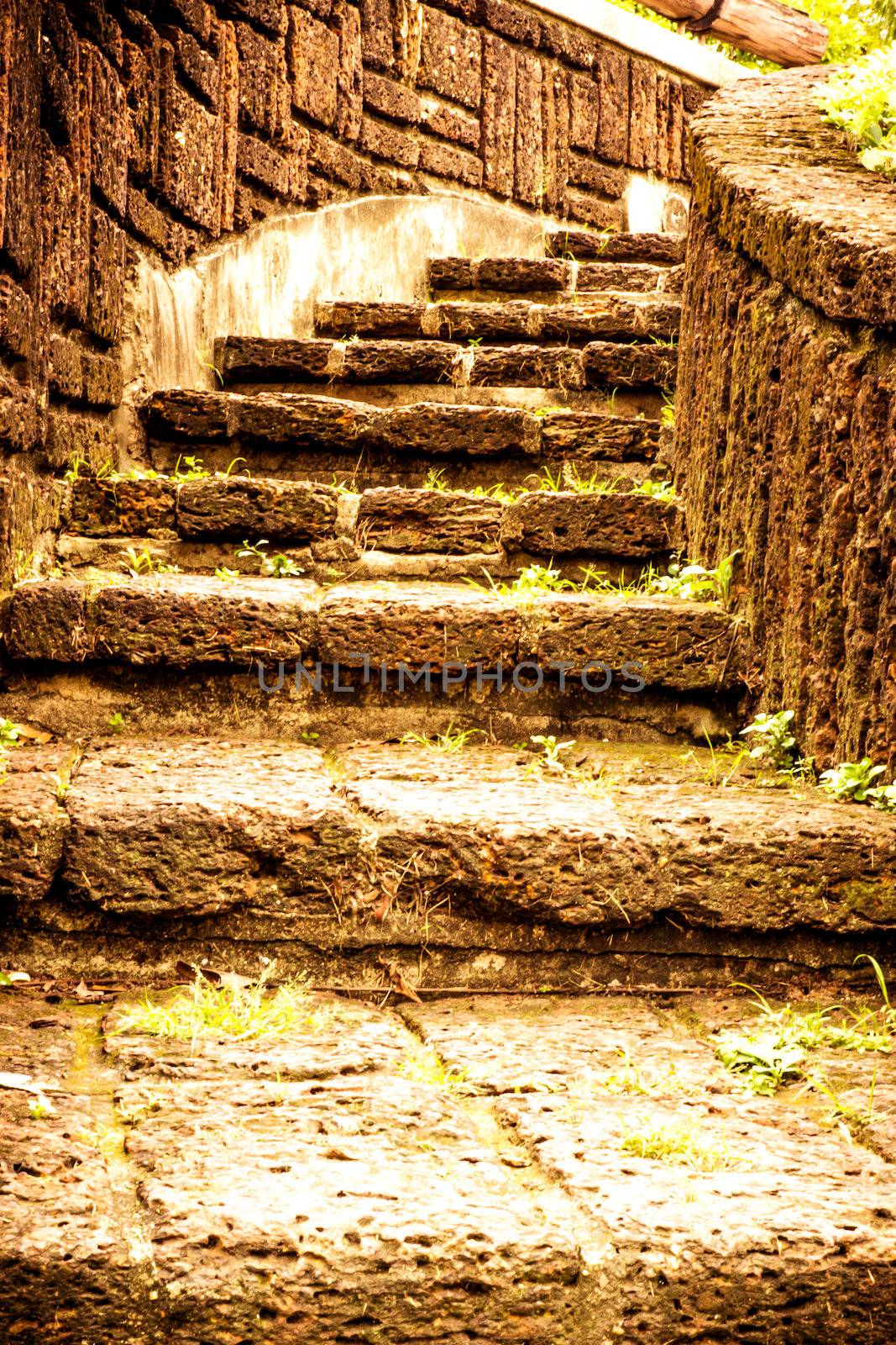 Brown stairway from stone  in garden.