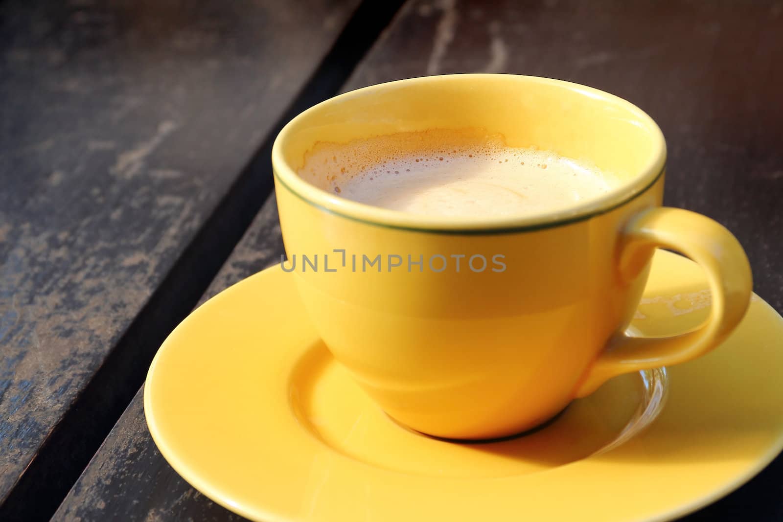 Cup of hot coffee on wooden table