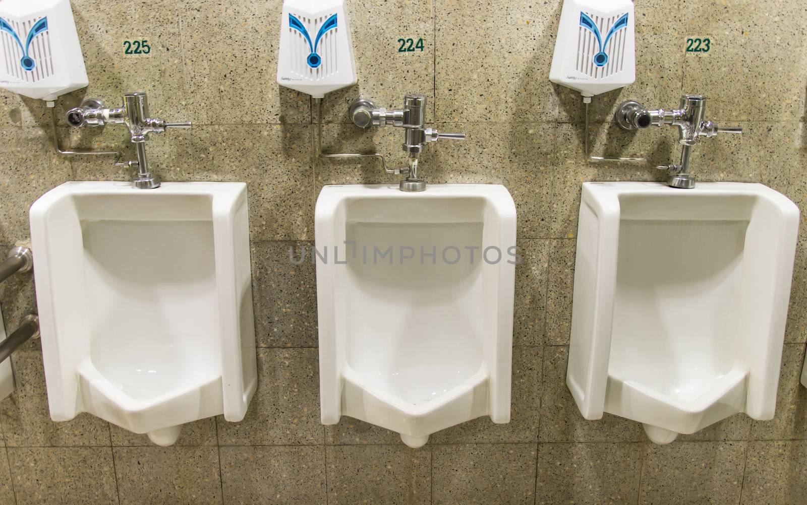 Urinals ,A collection of 3 urinals in a men's bathroom