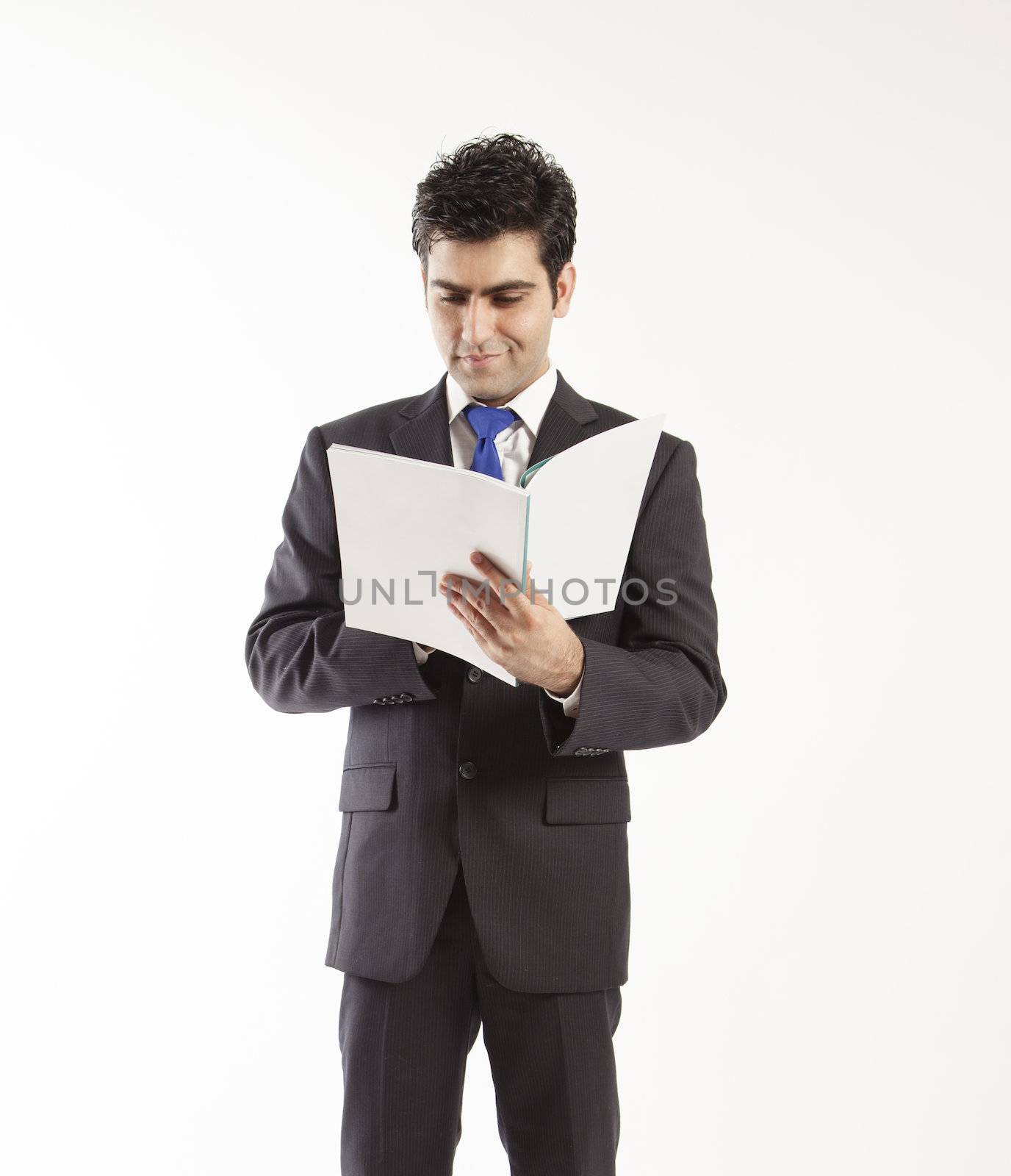 Bussiness man reading book by haiderazim