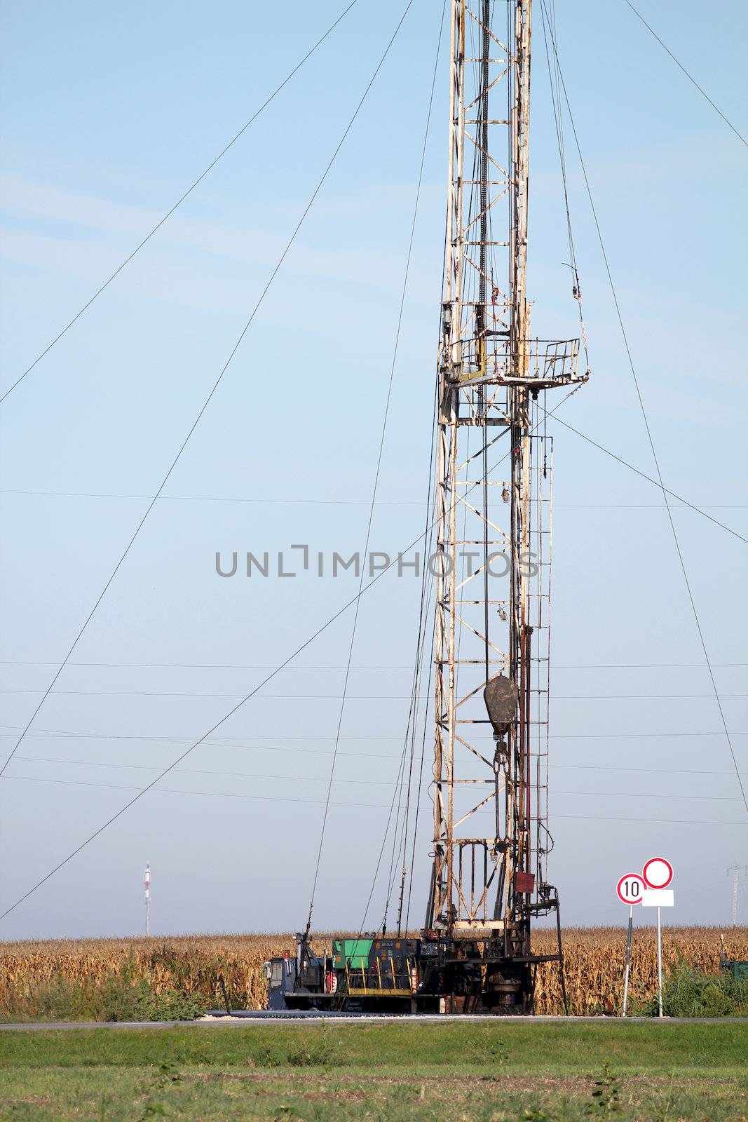 land oil drilling rig on field by goce