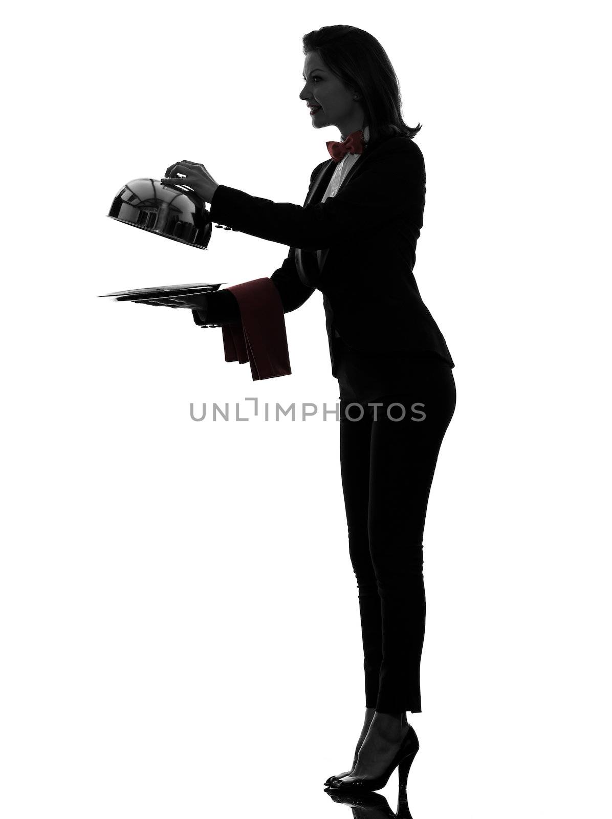 one caucasian woman waiter butler opening catering dome in silhouette  on white background