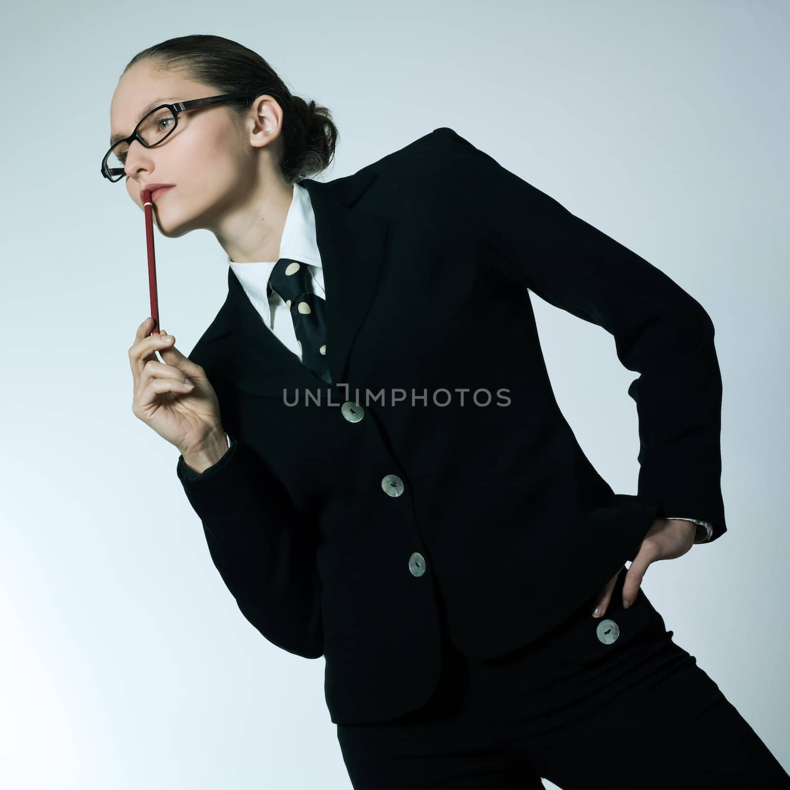 studio shot portrait of one business  woman thinking