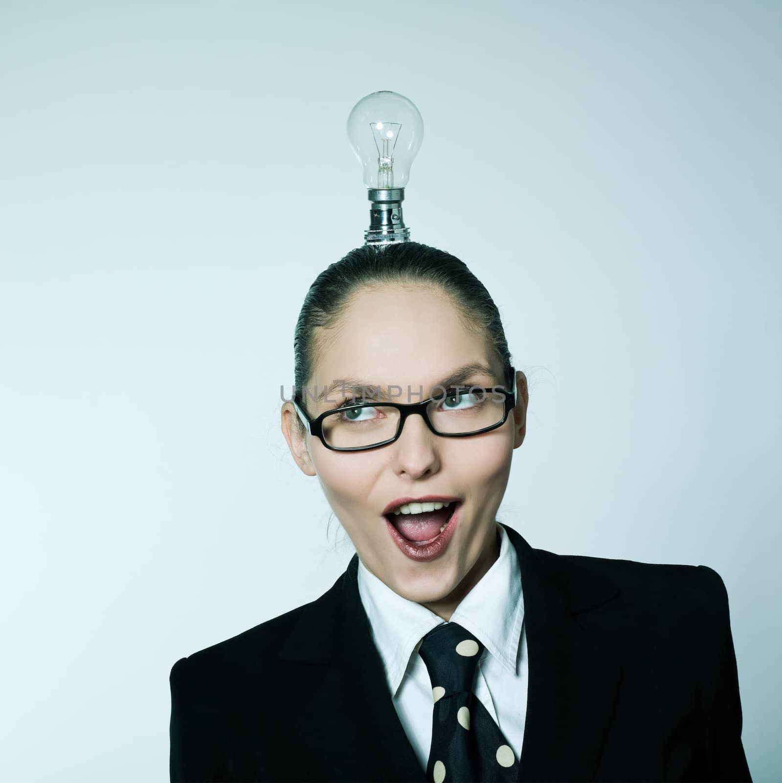 studio shot portrait of one caucasian young woman  having  little light over head