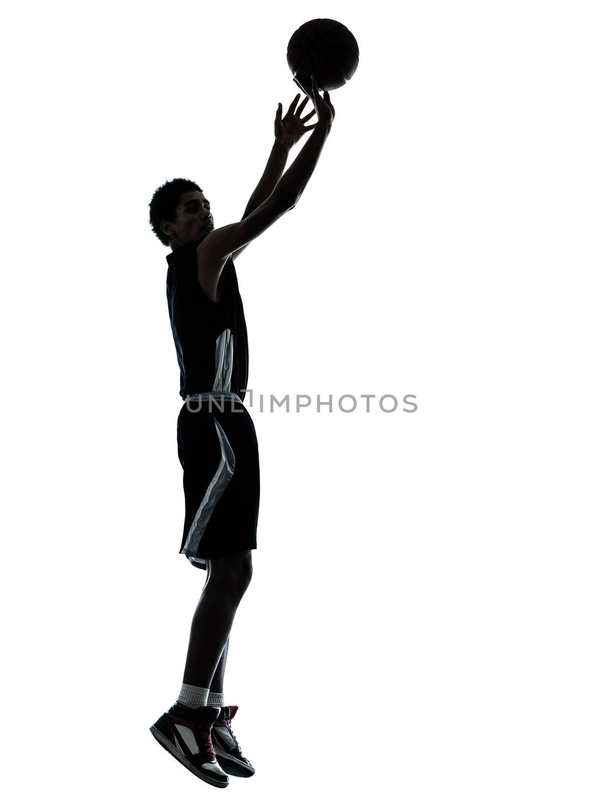 one young man basketball player silhouette in studio isolated on white background