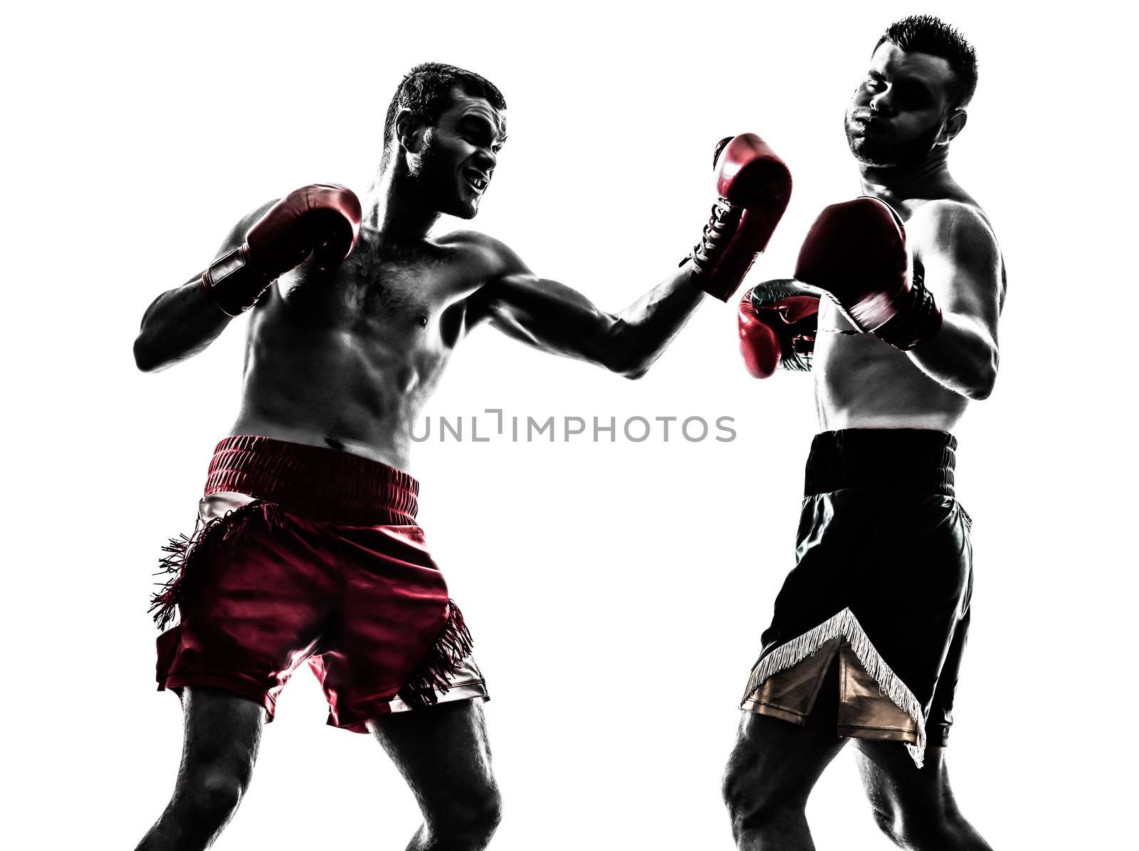 two caucasian  men exercising thai boxing in silhouette studio  on white background