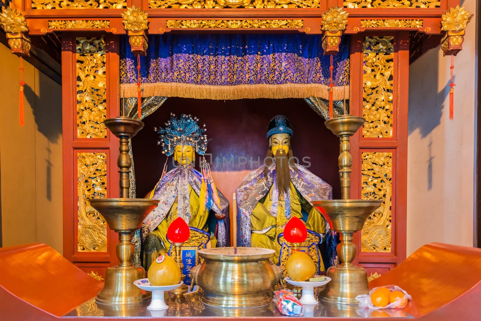 Shanghai, China - April 7, 2013: statues in the city god temple Chenghuang Miao  at the city of Shanghai in China on april 7th, 2013