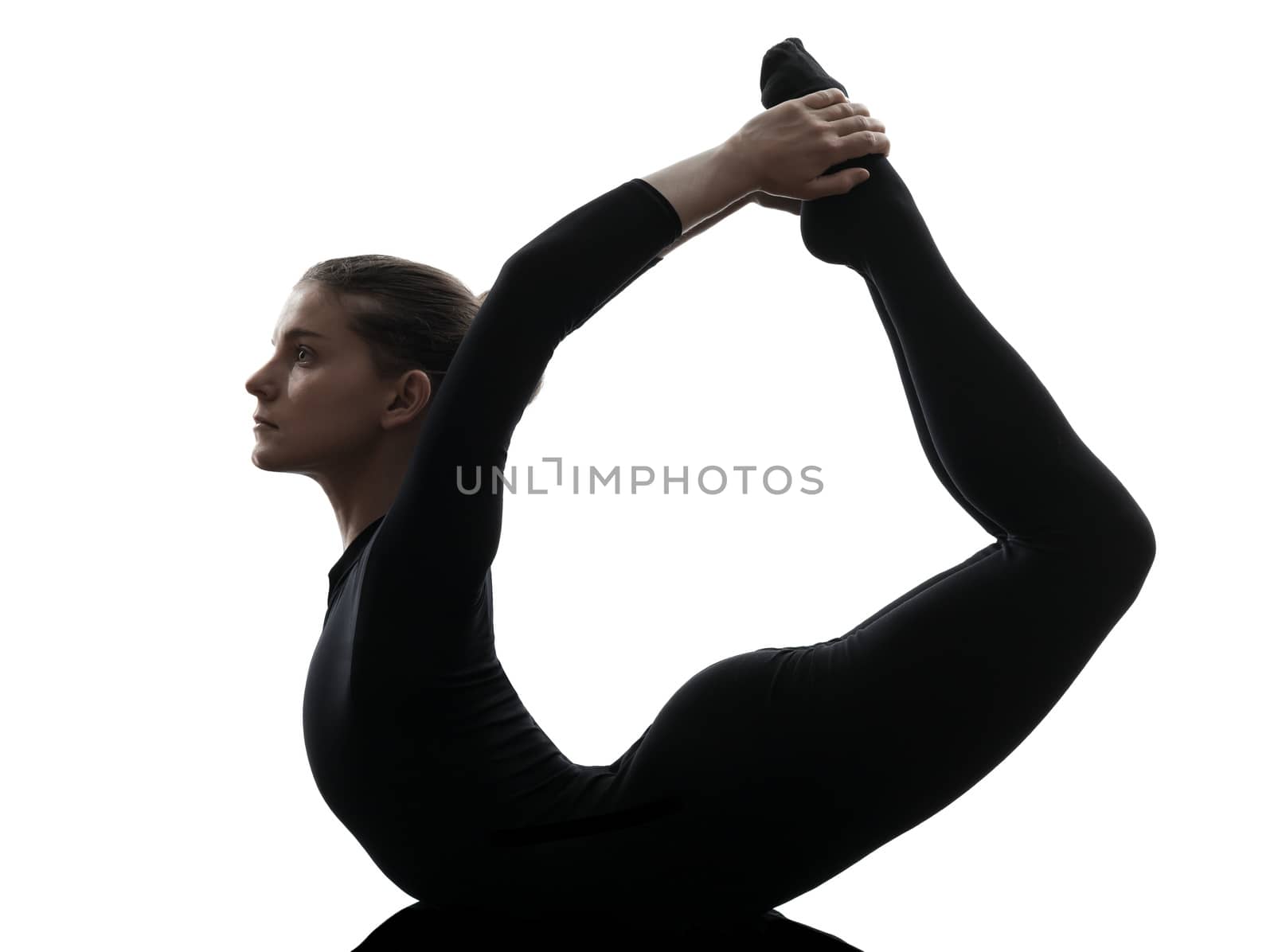 woman exercising gymnastic yoga urdhva dhanurasana upward bow po by PIXSTILL