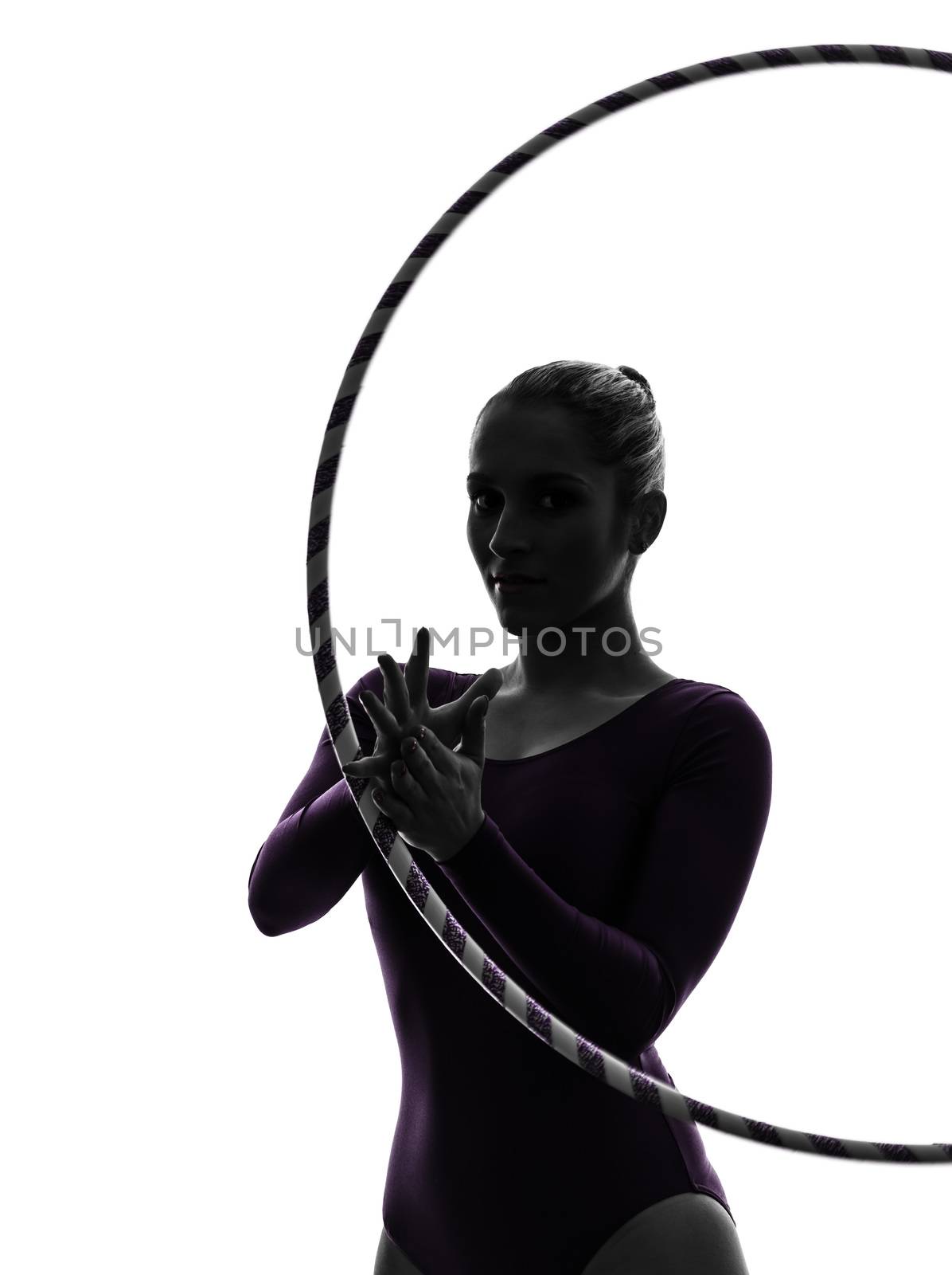 one caucasian woman exercising Rhythmic Gymnastics hula hoop  in silhouette studio isolated on white background