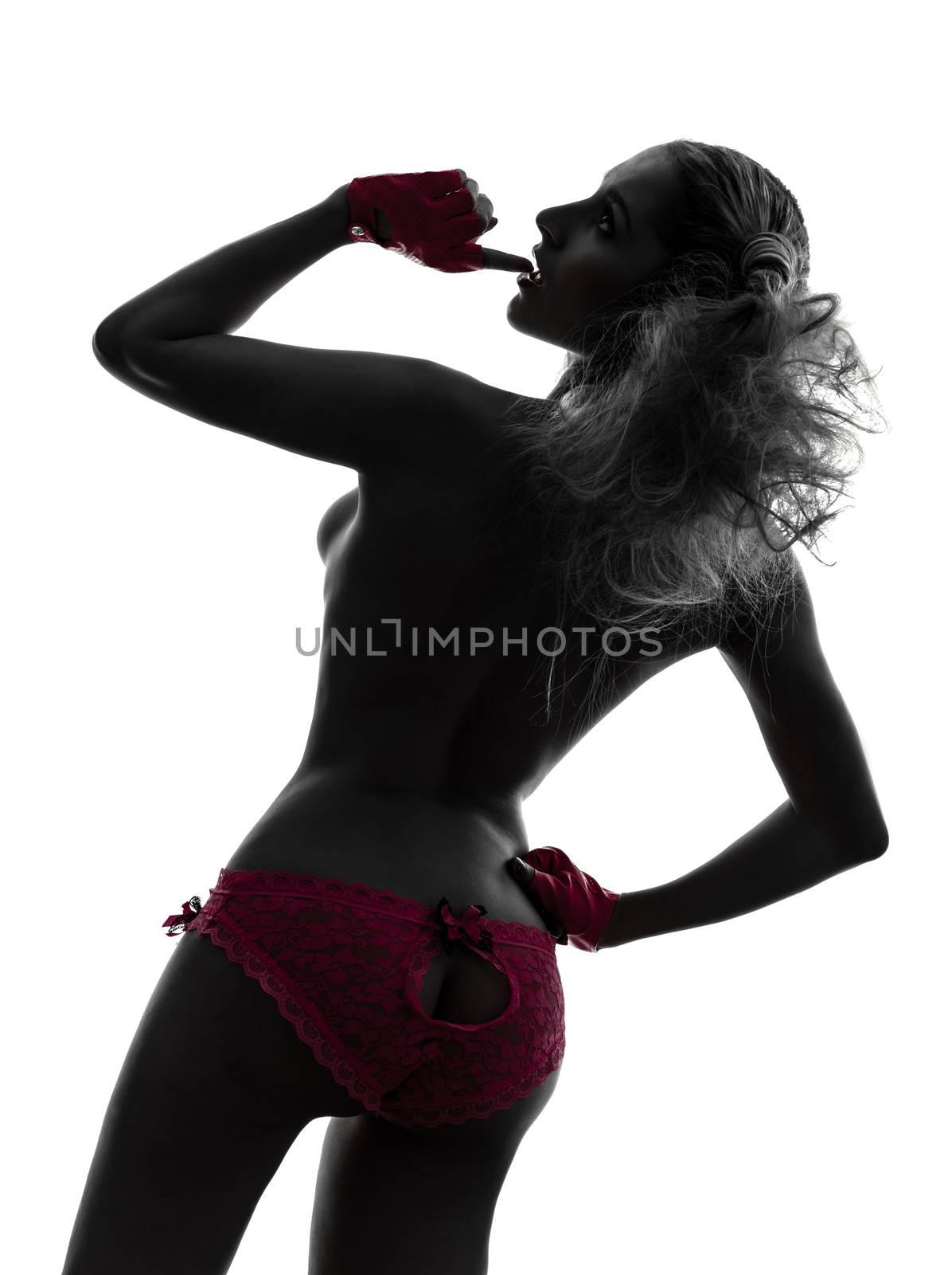 one caucasian sexy woman topless with pink underwear in silhouette studio isolated on white background