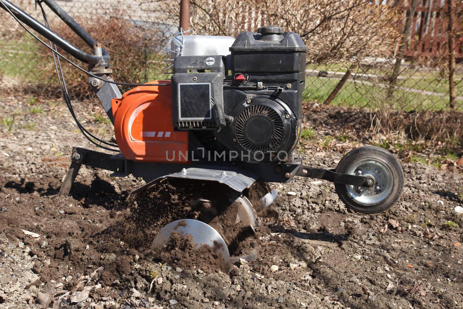 Spring work in a garden. rototiller cultivator .