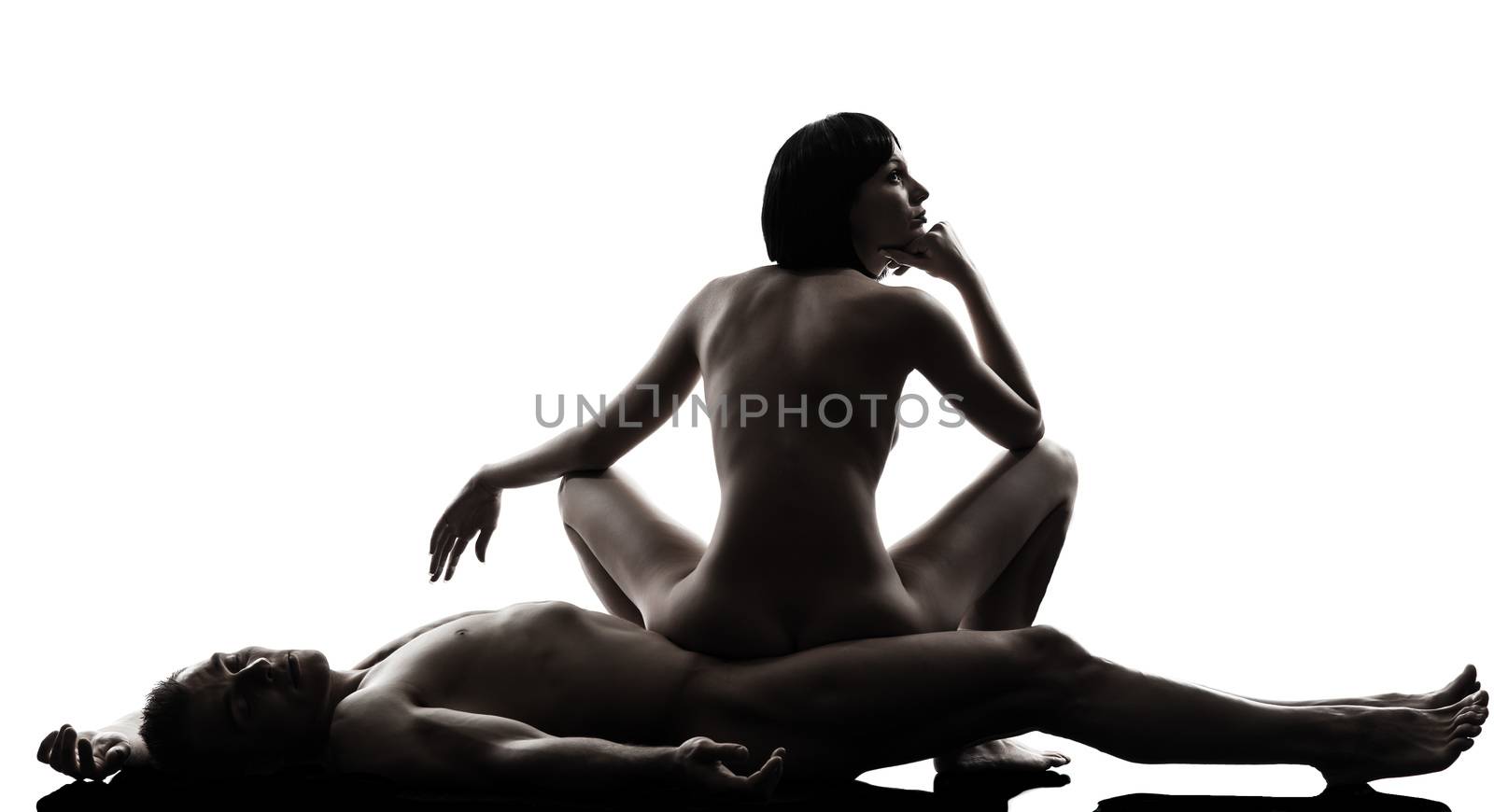 one caucasian couple man woman sexual kamasutra posture love activity  in silhouette studio on white background