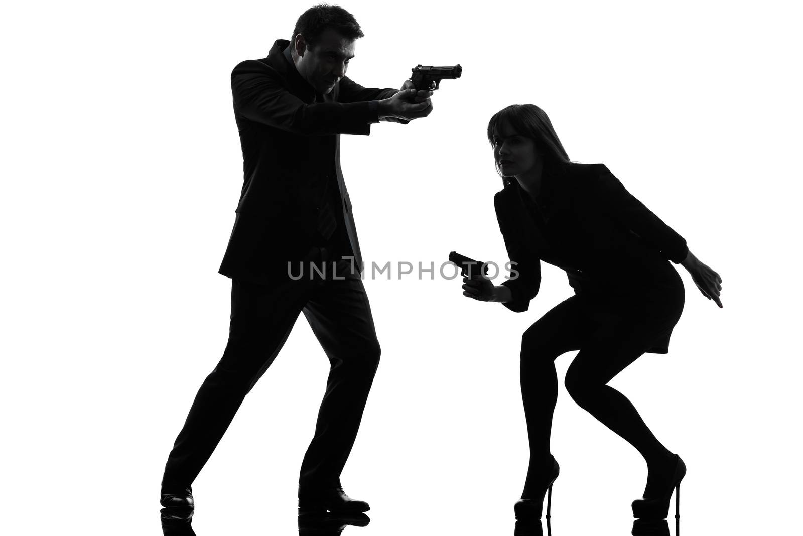 one caucasian man detective secret agent criminal  with gun  in silhouette studio isolated on white background
